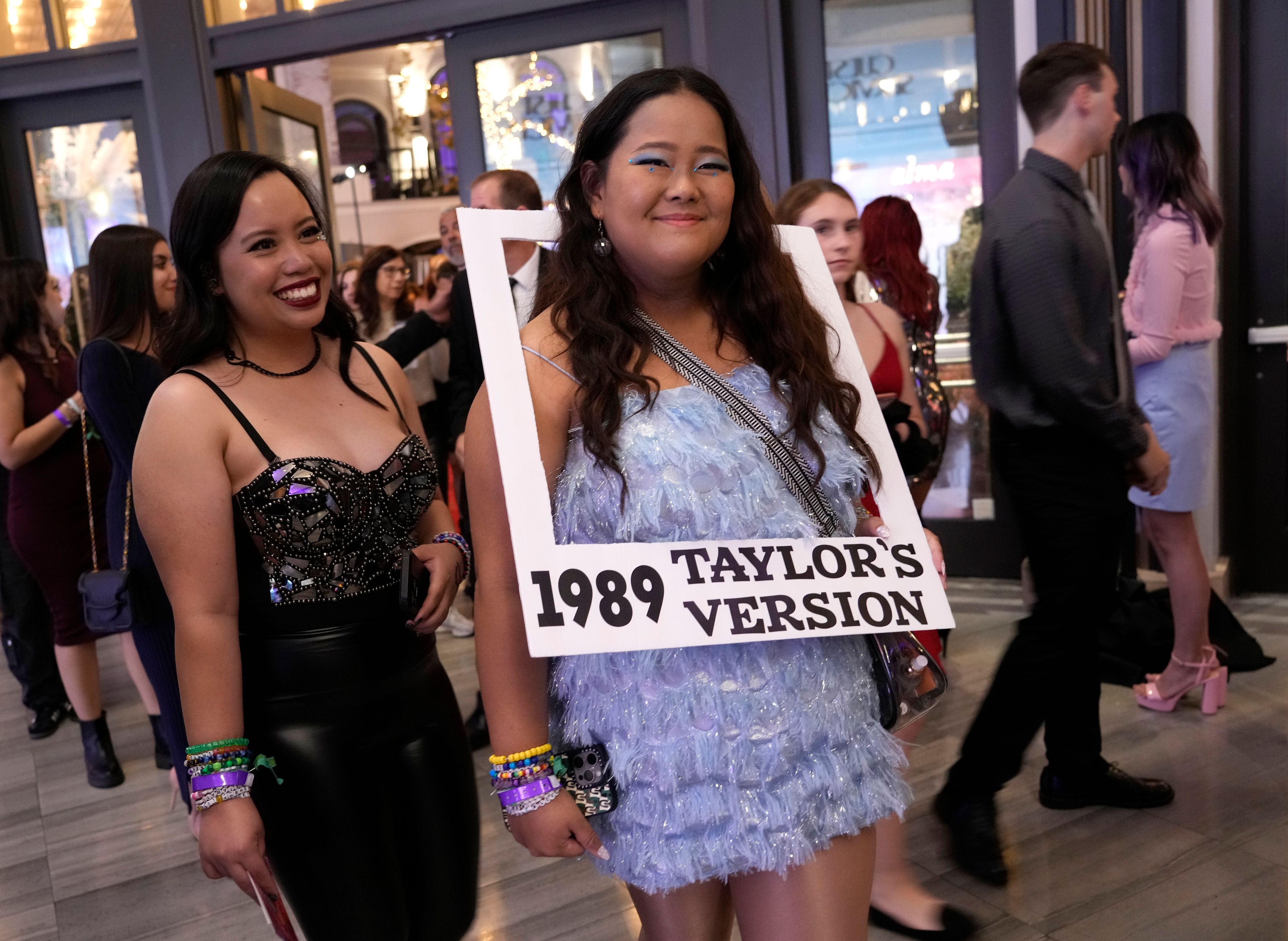 FILE - Karen Boncan, left, and Petrushka Seville arrive at the world premiere of the concert film "Taylor Swift: The Eras Tour" on Oct. 11, 2023, in Los Angeles. (AP Photo/Chris Pizzello, File)