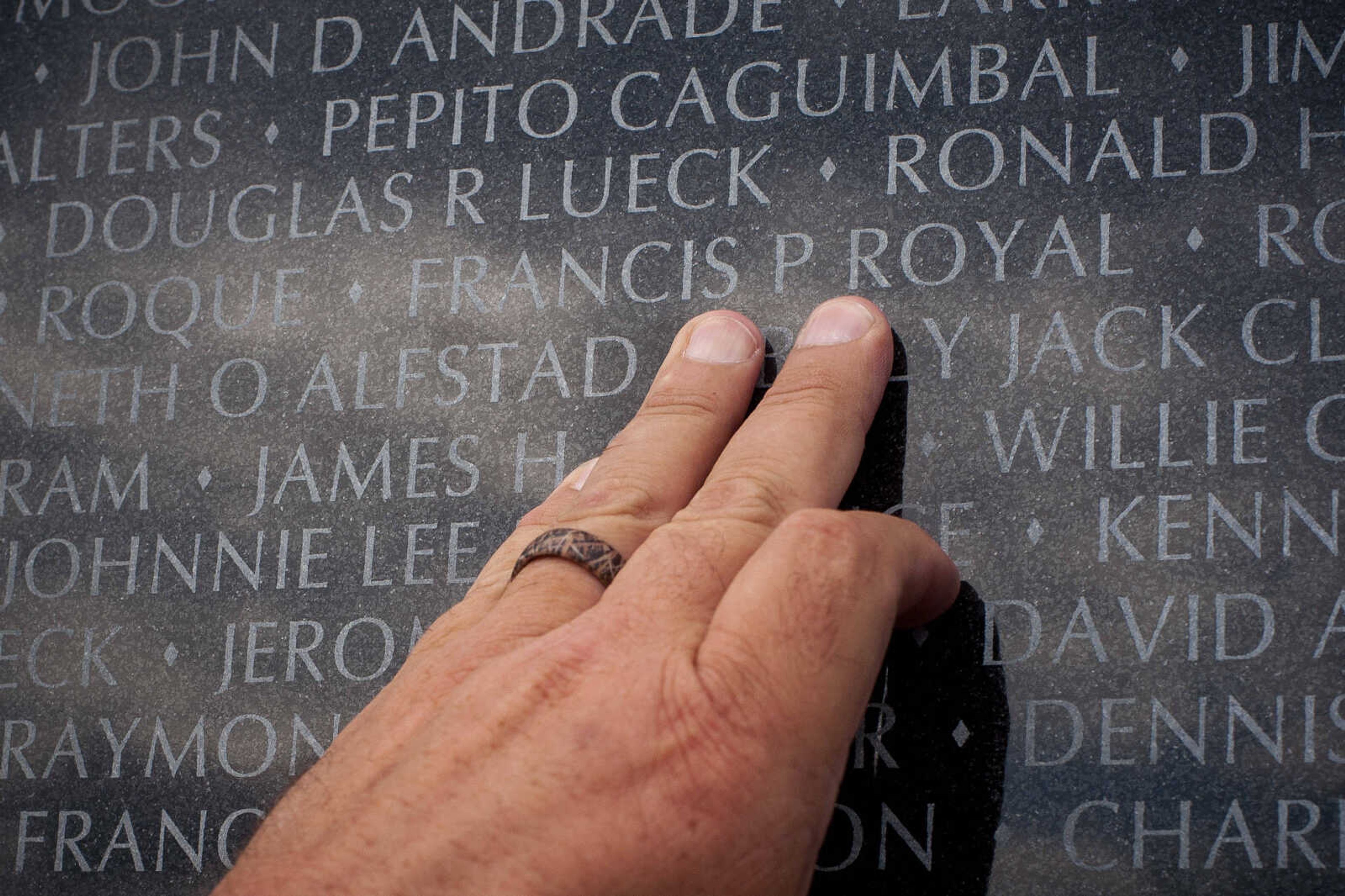 Tom Royal touches the name of his brother, Francis P. Royal, inscribed on the wall during the first-ever Missouri Vietnam Wall Run  Saturday, Sept. 21, 2019, at the Missouri's National Veterans Memorial in Perryville.