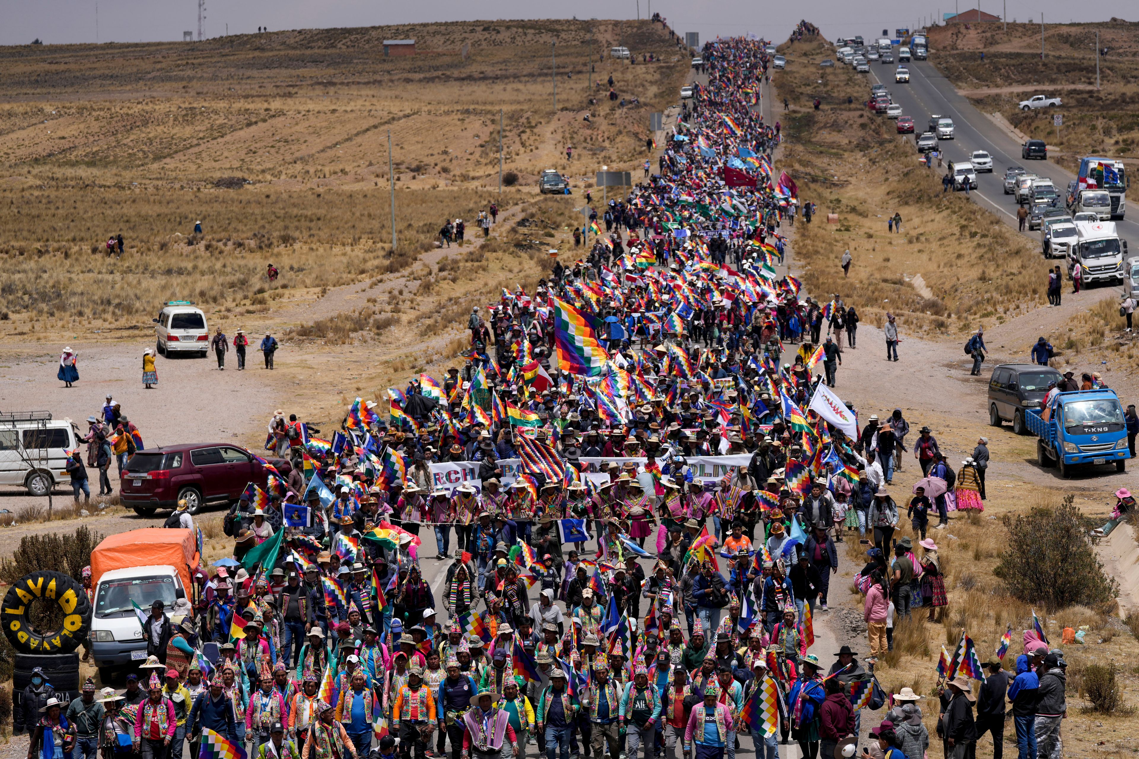 Supporters of former President Evo Morales march to the capital to protest the government of current President Luis Arce near El Alto, Bolivia, Sunday, Sept. 22, 2024. (AP Photo/Juan Karita)