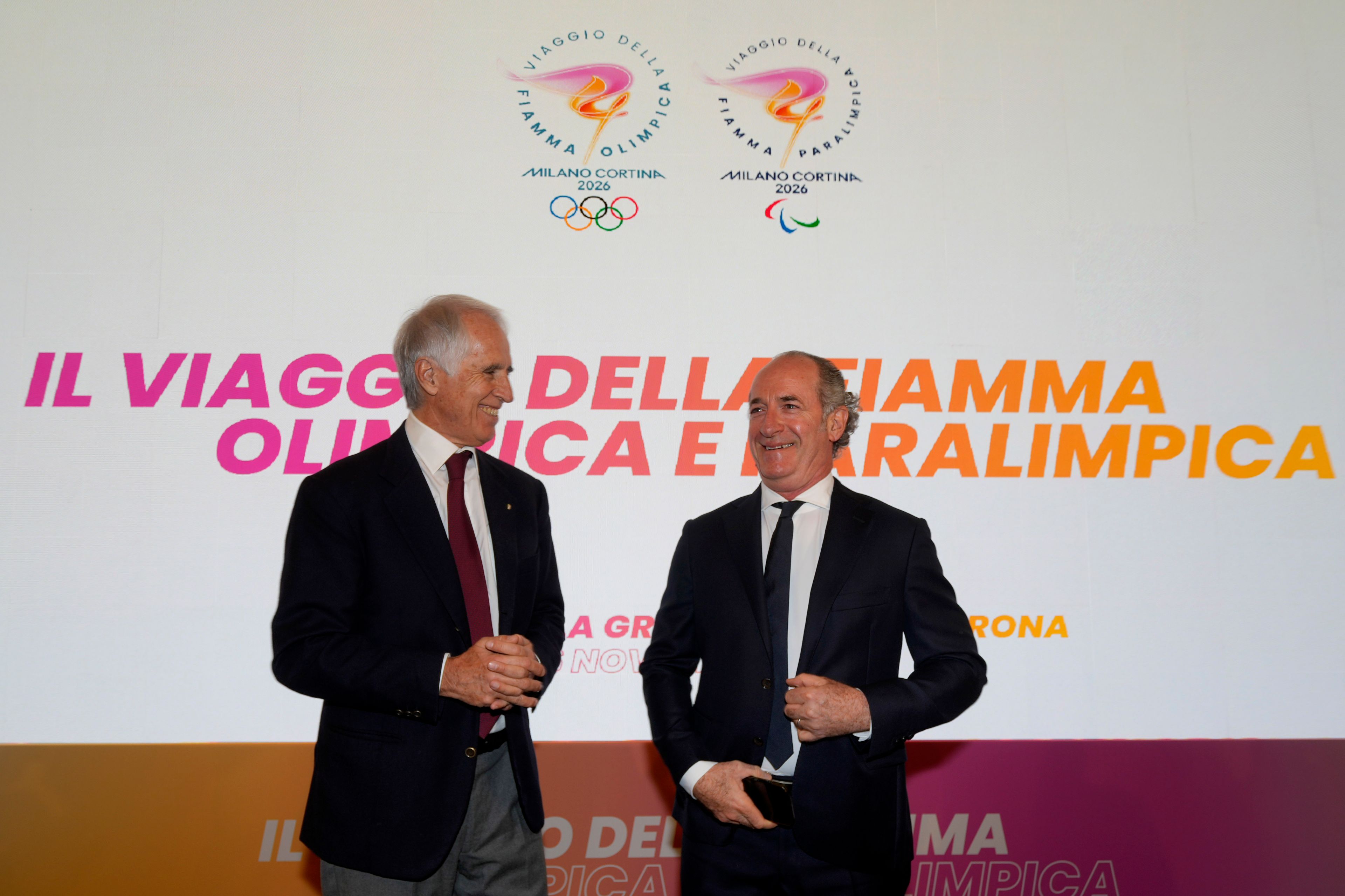 President of the Italian National Olympic Committee, Giovanni Malago' is flanked by President of the Veneto Region Luca Zaia during a news conference to present the route of the 2026 Winter Olympics and Paralympics torch route, in Verona, Italy, Tuesday, Nov. 26, 2024. (AP Photo/Luca Bruno)