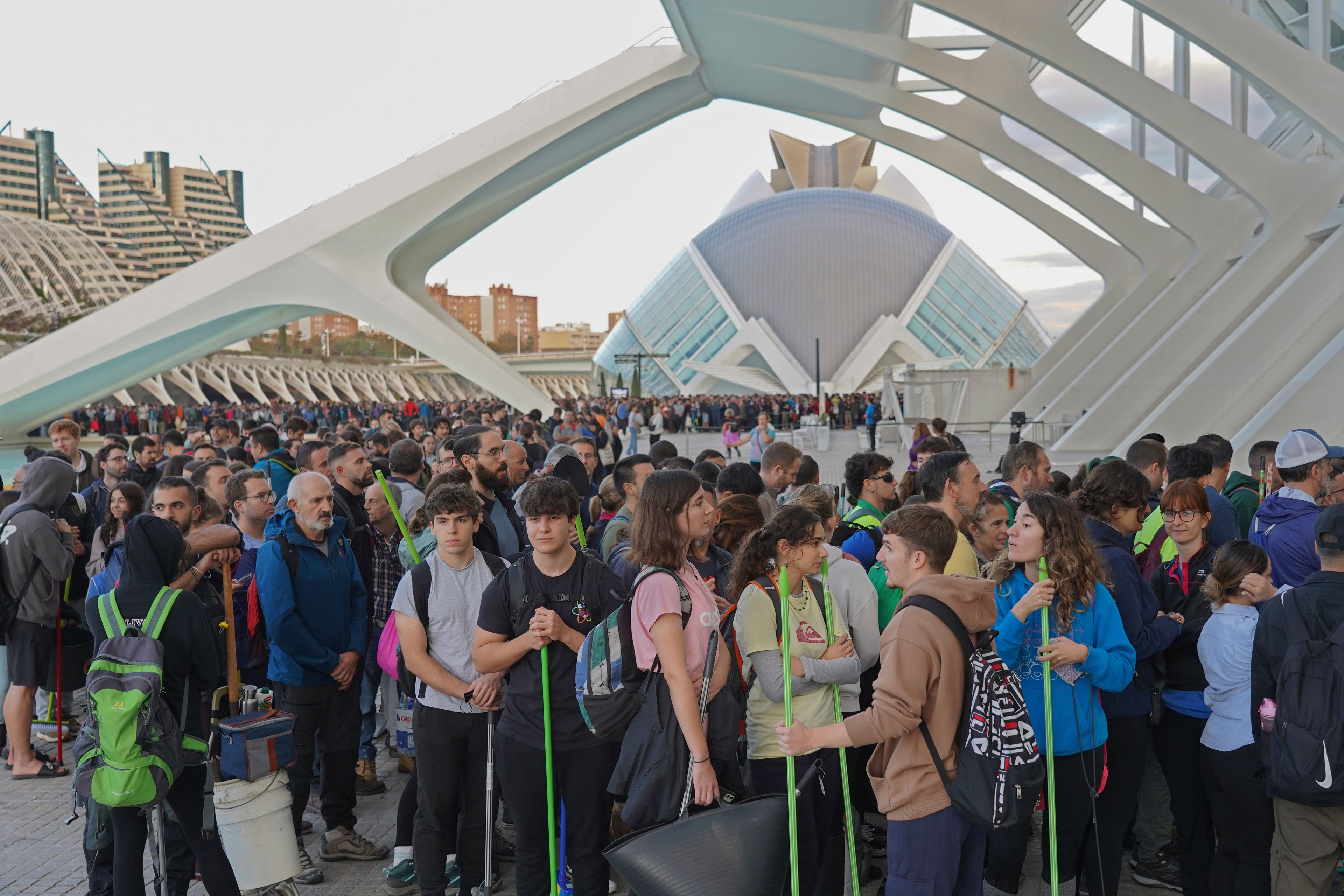 Thousands of volunteers show up at the City of Arts and Sciences cultural complex to be assigned work schedules to help with the clean up operation after floods in Valencia, Spain, Saturday, Nov. 2, 2024. (AP Photo/Alberto Saiz)