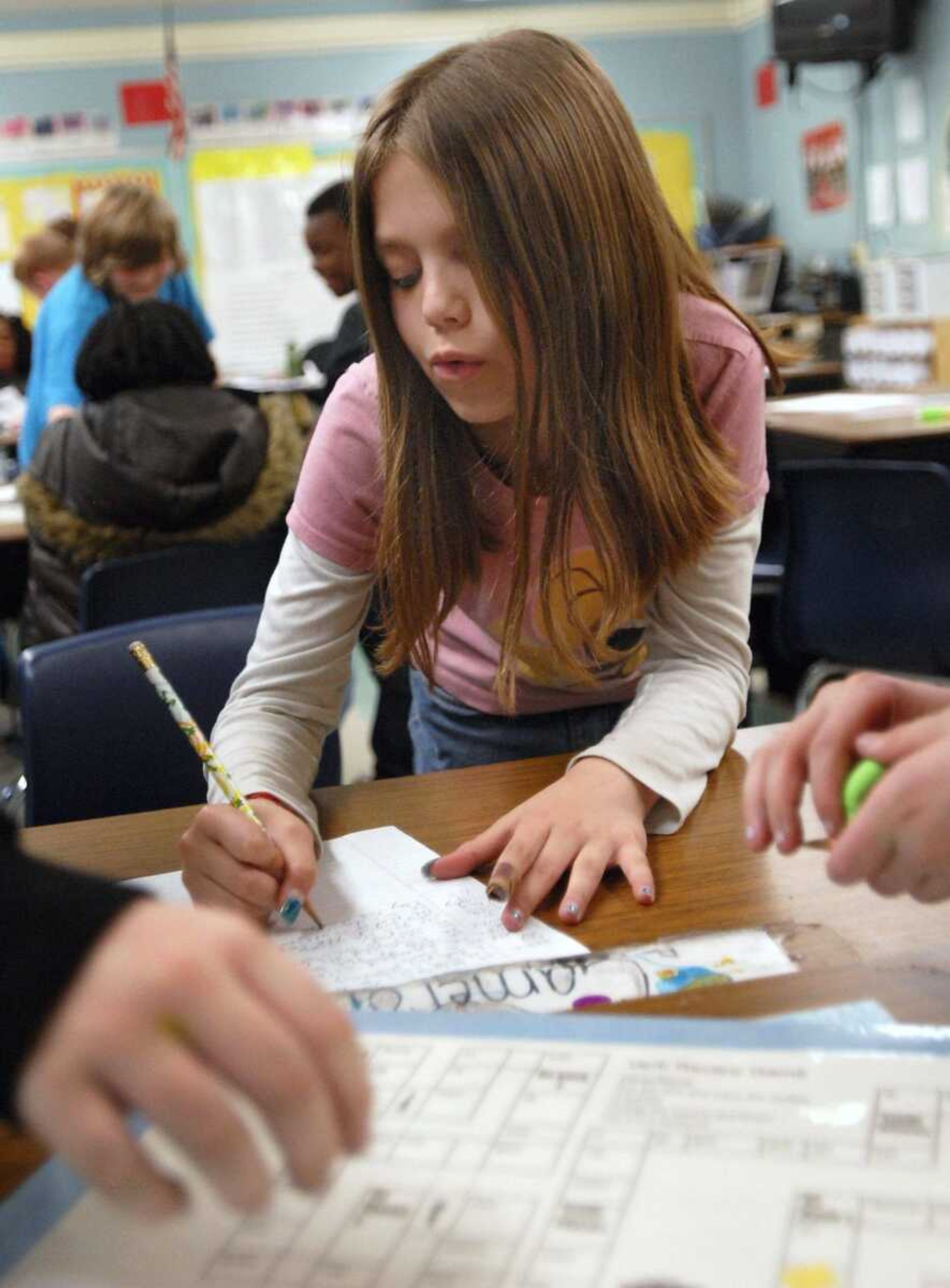 Fourth-grade student Lacey Graham works with classmates on a verb review game Thursday at Jefferson Elementary School in Cape Girardeau. Southeast Missouri State University has begun a campaign aimed at anticipating and preparing for the technological needs of the next decade of students. (Kristin Eberts)