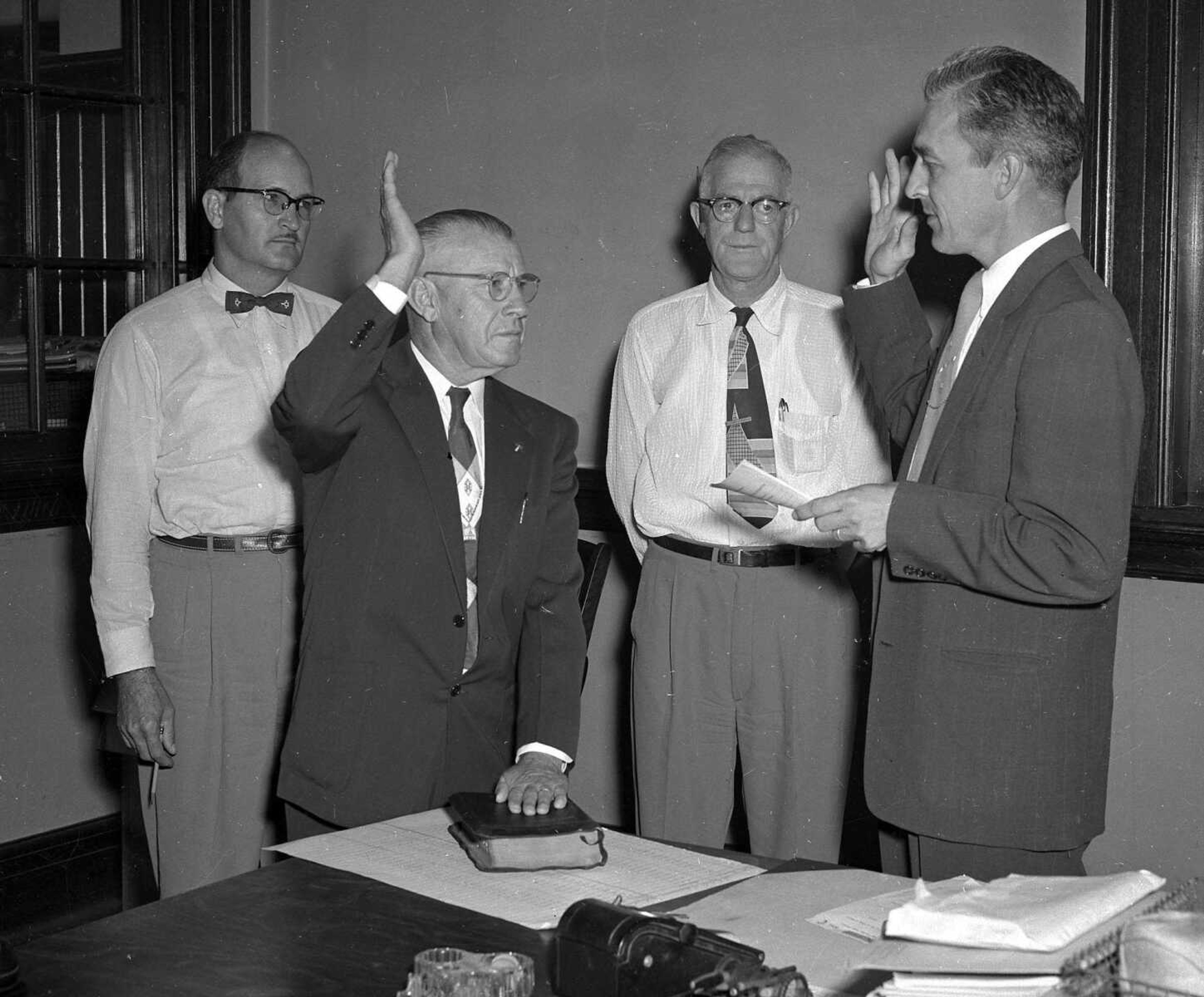 While this is obviously a swearing-in ceremony, we have no idea who these men are. If you can provide information about this image, send librarian Sharon Sanders a note at ssanders@semissourian.com.