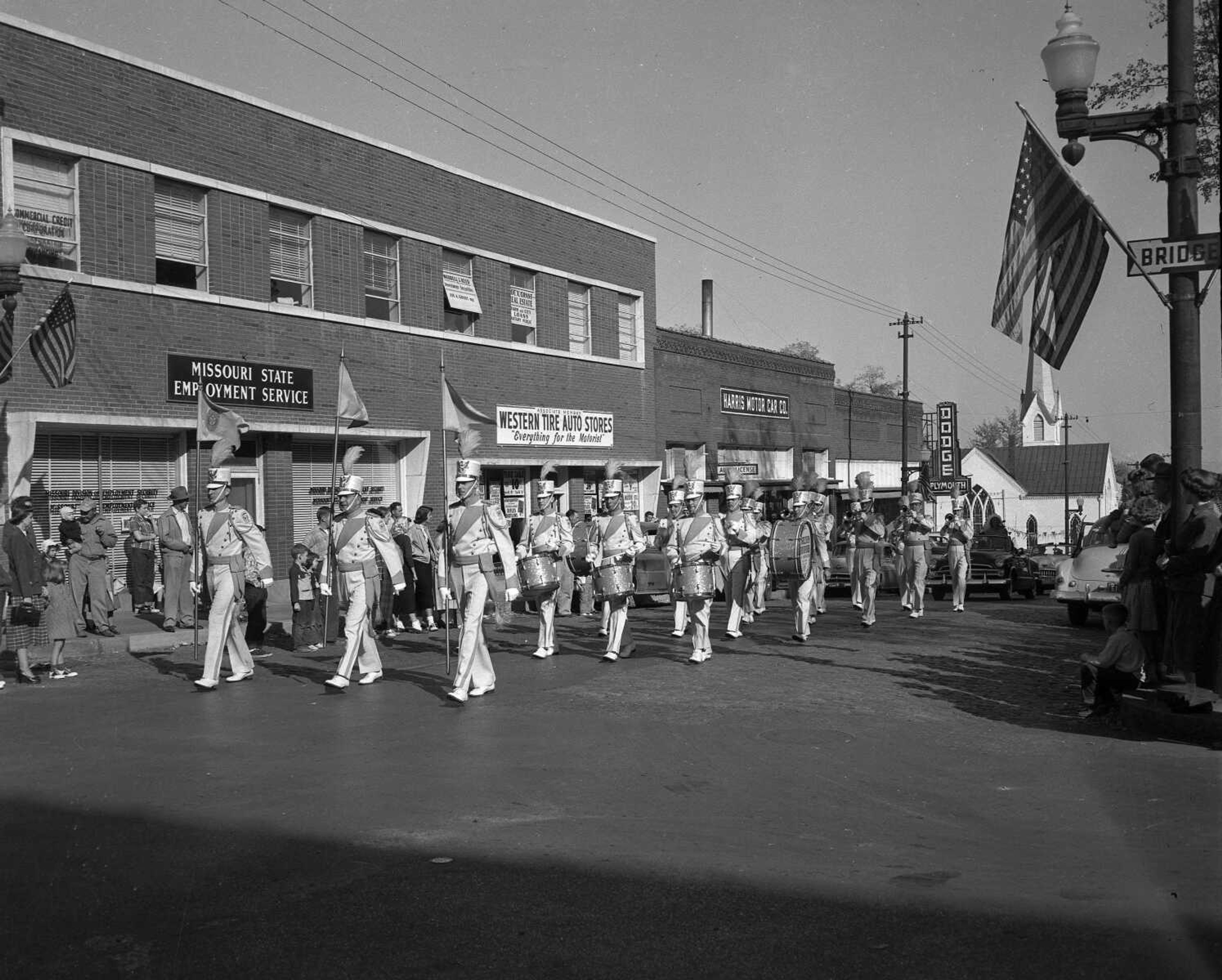 The photo may be undated, but the identification of this group is obvious. These are the Golden Troopers, the Cape Girardeau American Legion's drum and bugle corps, marching west in the 200 block of Broadway.