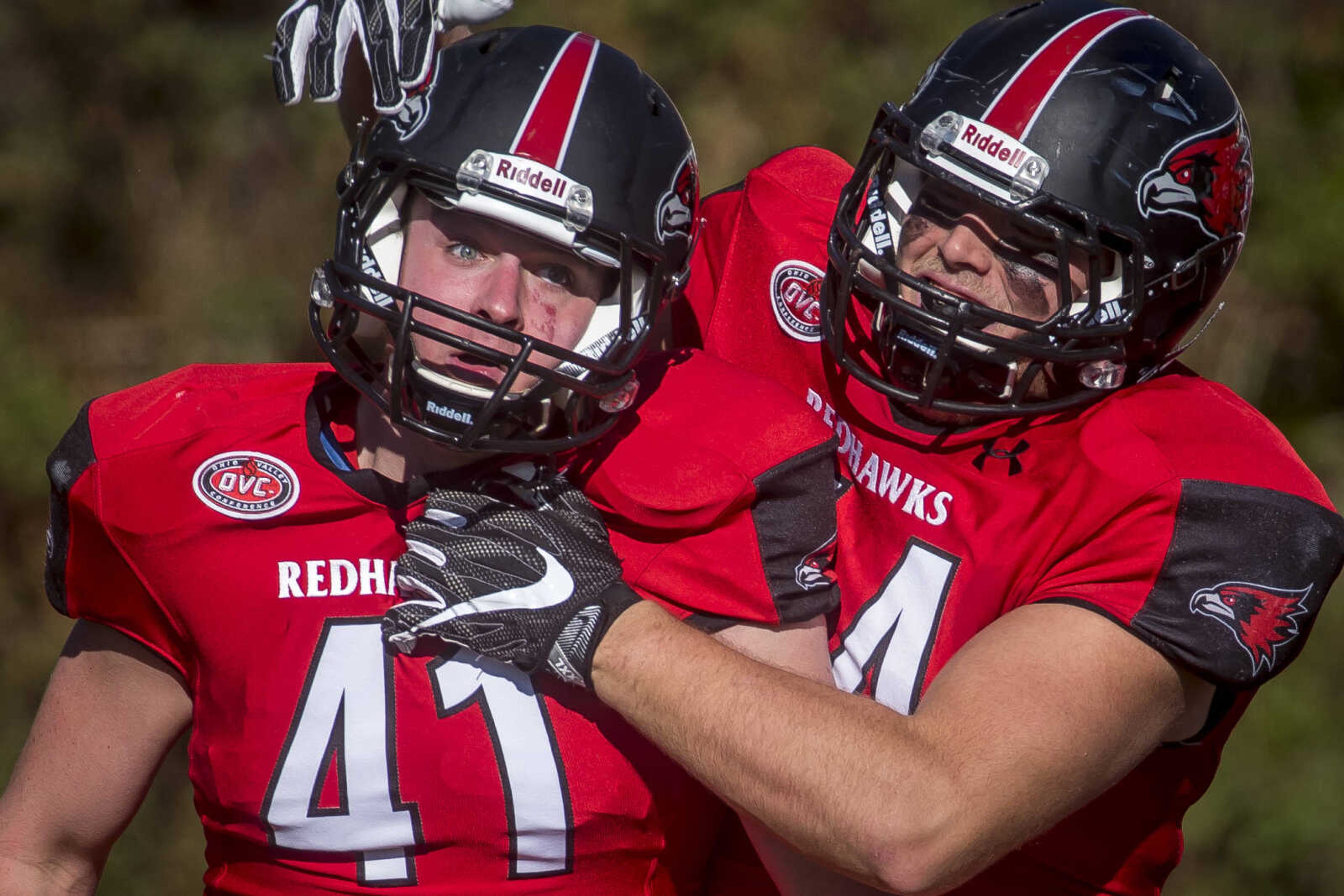 Southeast's Camden Boyle (41) is congratulated by his teammate, tight end Bud Hilburn (44)
after Boyle dished out a hard tackle to Stony Brook wide receiver Donavin Washington during the Redhawks' 28-14 playoff win Saturday, Nov. 24, 2018.