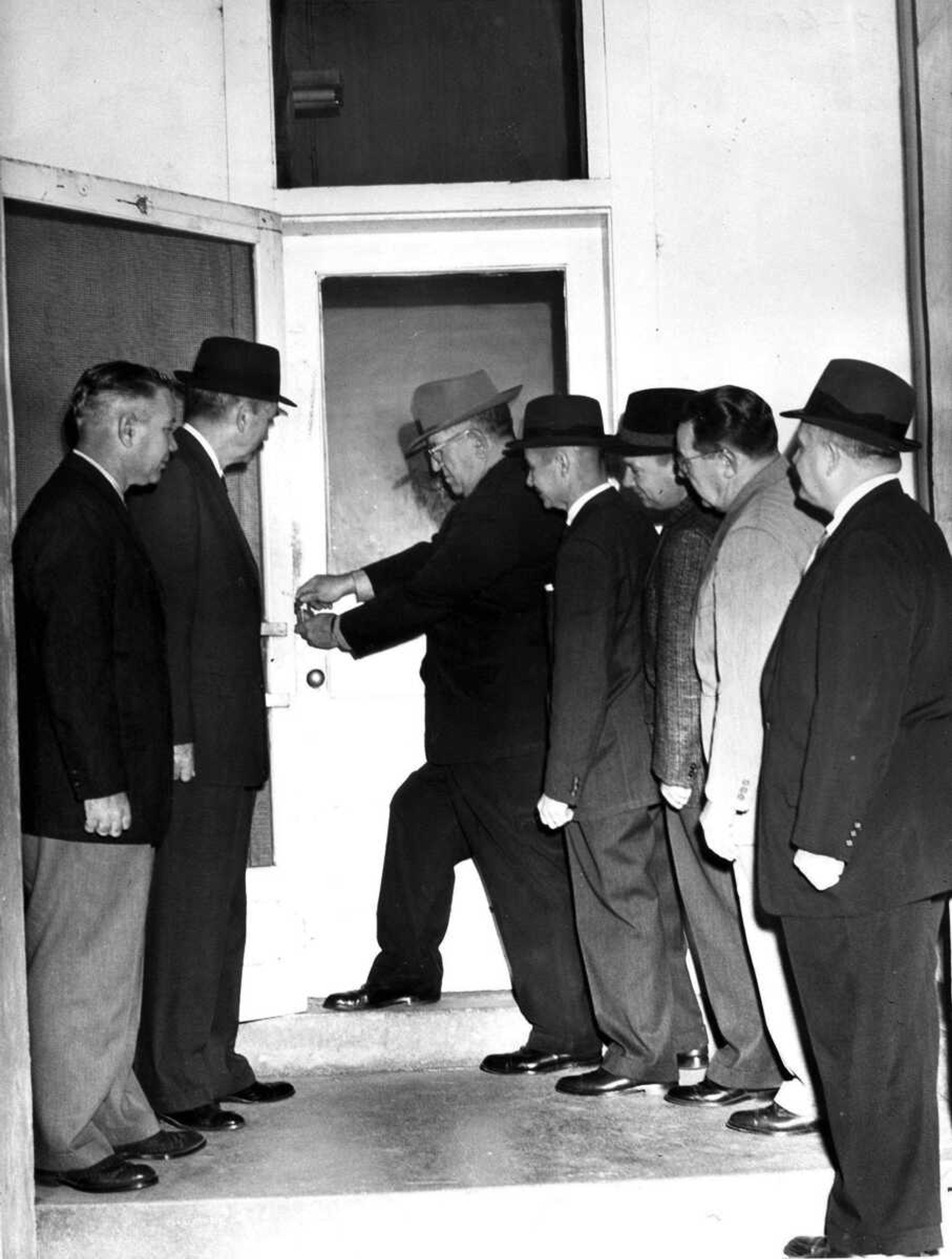 SOUTHEAST MISSOURIAN ~ photos@semissourian.com
Jan. 2, 1960
Padlocking old quarters for the first time in about 50 years the old police headquarters building on Frederick was padlocked as the department transferred a block west to the renovated Grace Methodist Church building. As Police Chief Percy R. Little affixes the lock, from the left, are City Commissioners J. Weldon McBride and U.G. Pettigrew, City Attorney Raymond H. Vogel, Max G. Stovall and John L. Wieser and Mayor Walter H. Ford.