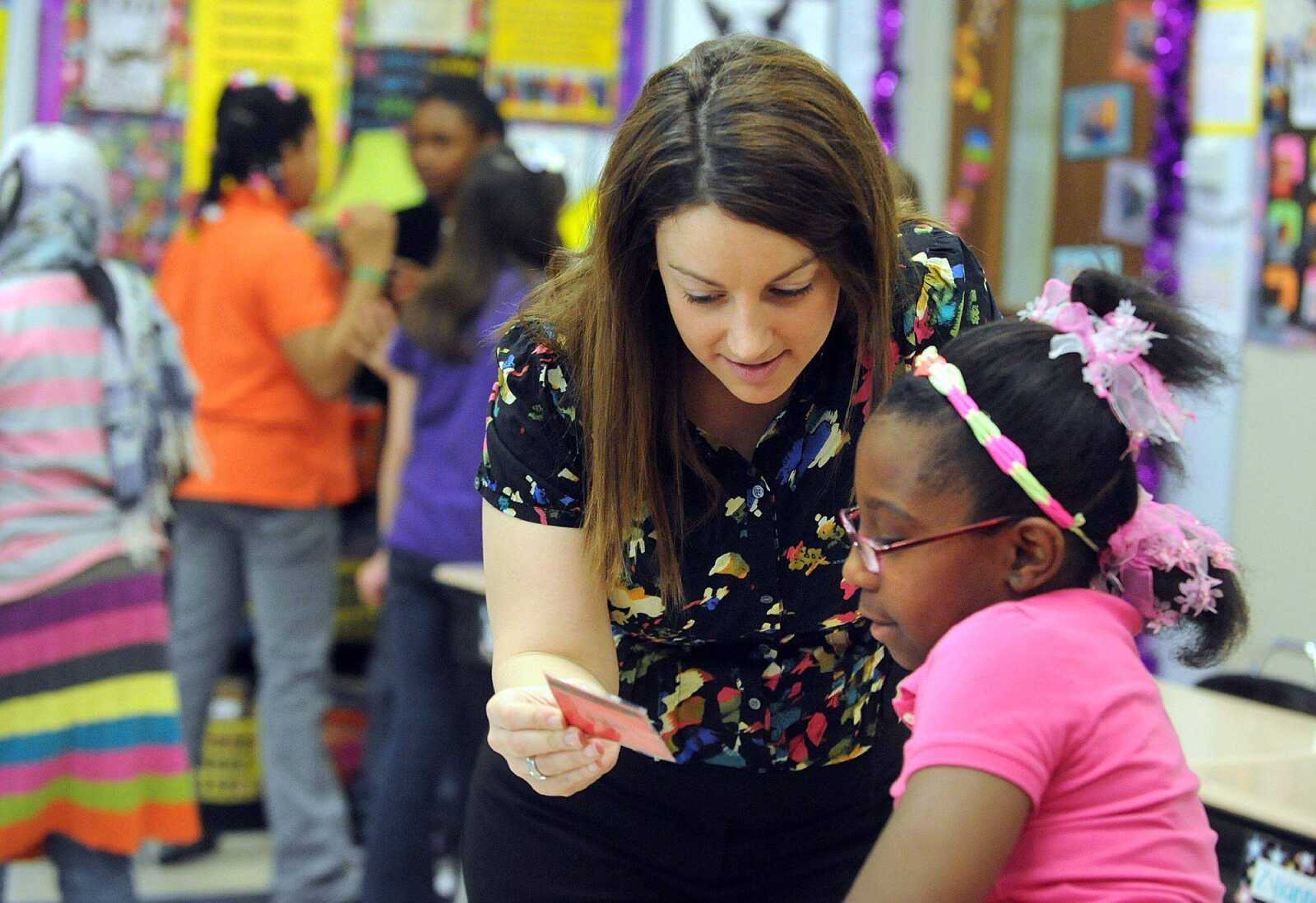 Blanchard Elementary fourth-grade teacher Kristi Pennington works with student Zyianna Boens during a spelling exercise Monday morning. (Laura Simon)