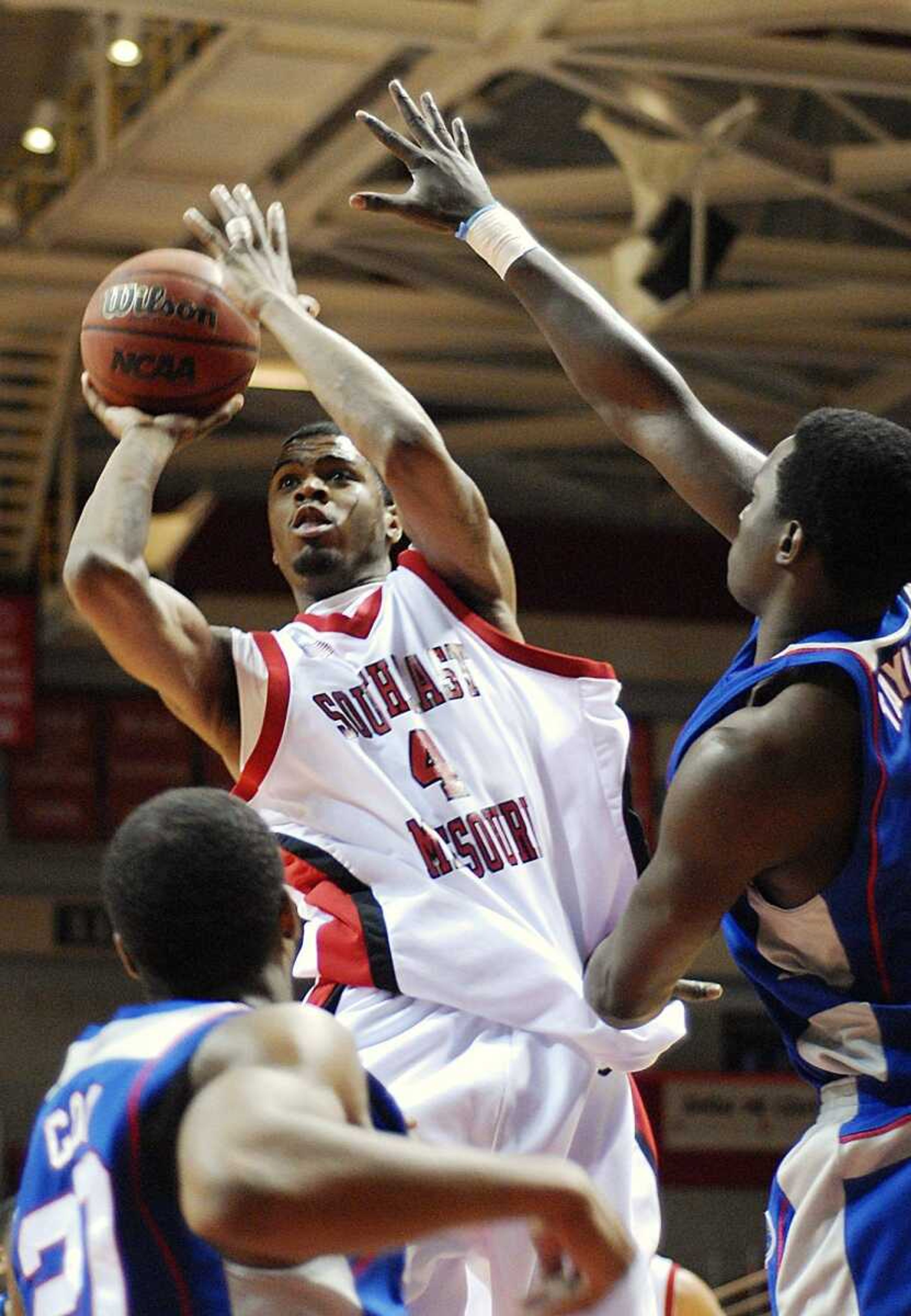 Southeast Missouri State's Calvin Williams put up a shot over two Tennessee State defenders during the first half Thursday at the Show Me Center. (Aaron Eisenhauer)