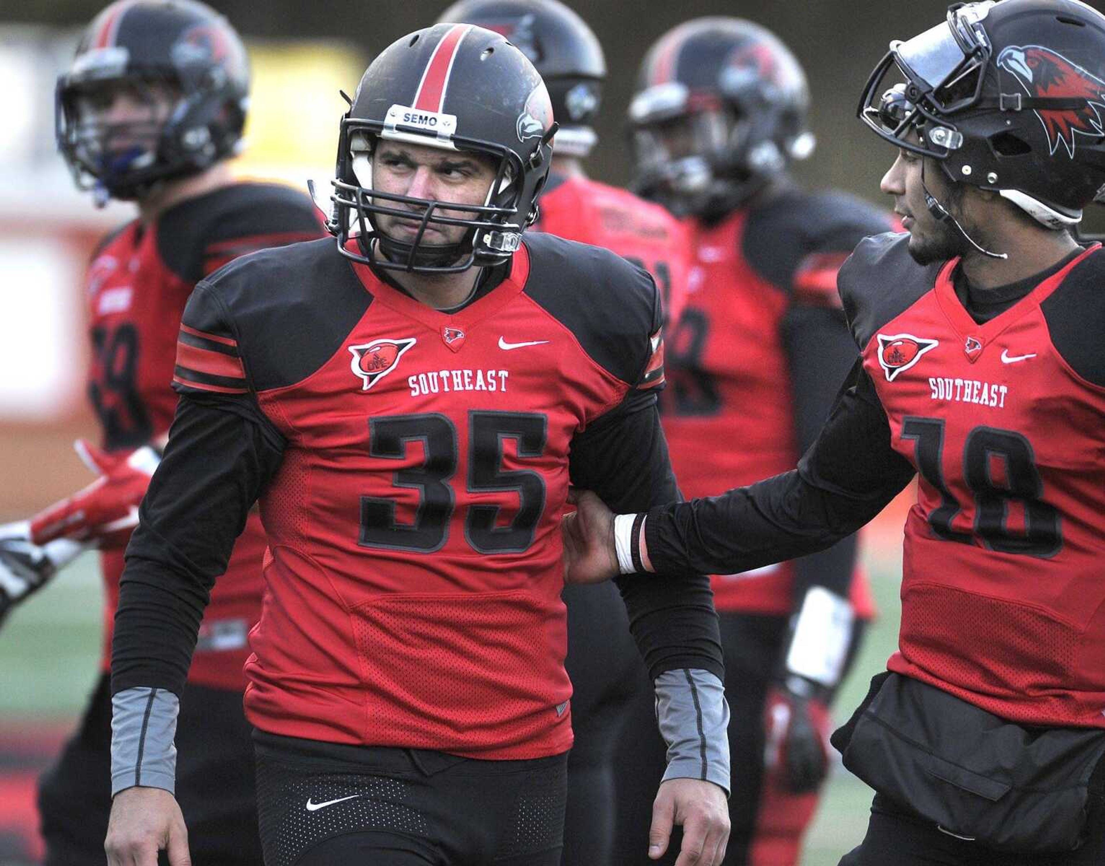 Southeast Missouri State kicker Ryan McCrum, left, is consoled by quarterback Dante Vandeven after McCrum missed a field goal attempt in the final seconds that would have tied the game with UT Martin on Saturday at Houck Stadium. (Fred Lynch)