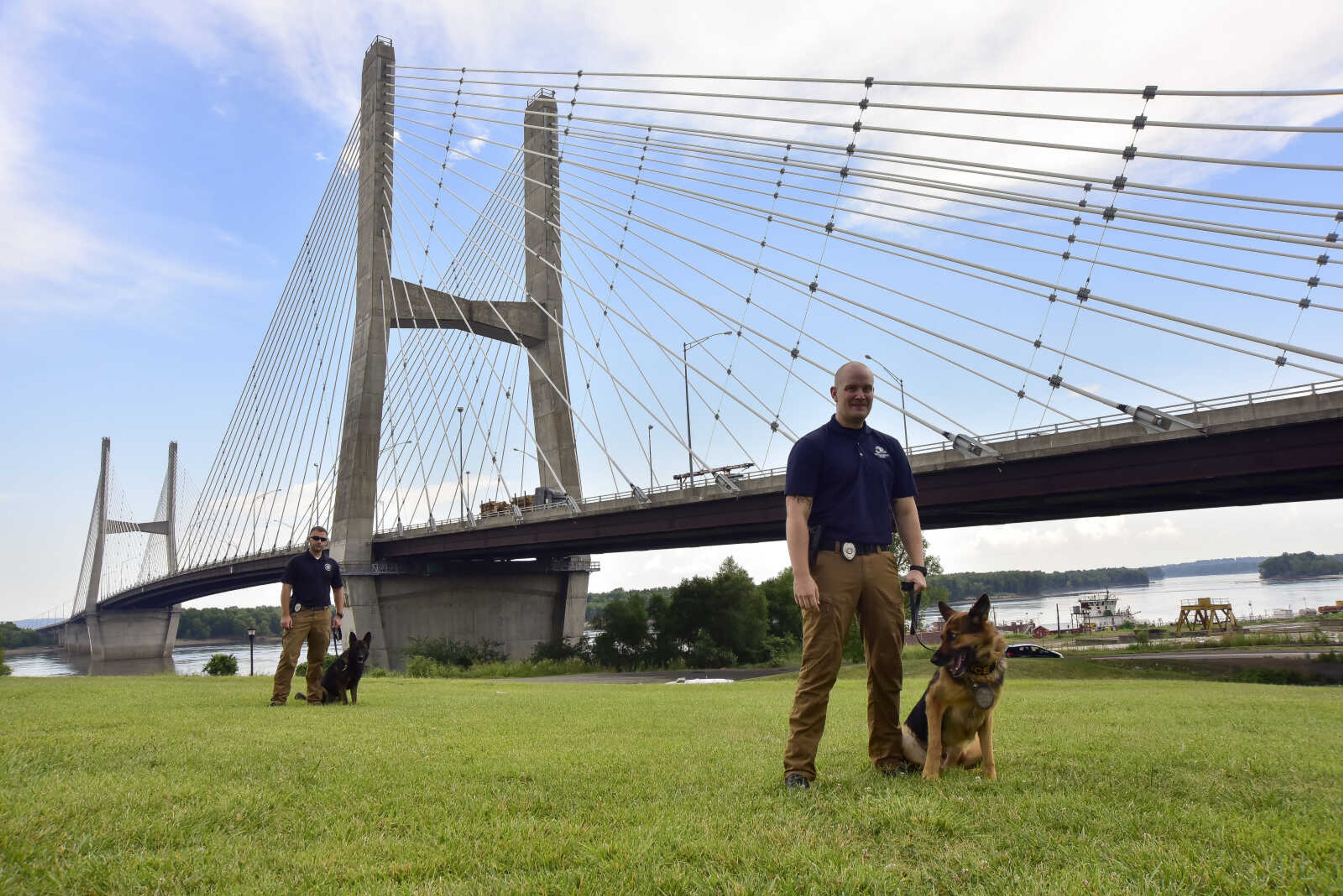 Sgt. Bryan Blanner with K-9 officer Schupo and Officer Eric Steiner and K-9 officer Dallas pose for a photo outside of the Southeast Missouri State River Campus Monday, July 17, 2017 in Cape Girardeau. Officer Dallas recently joined the force while officer Schupo will soon retire later this September. The Cape Police Department plans to obtain two more K-9 officers, of a total of four, having one on duty for every shift in a day.