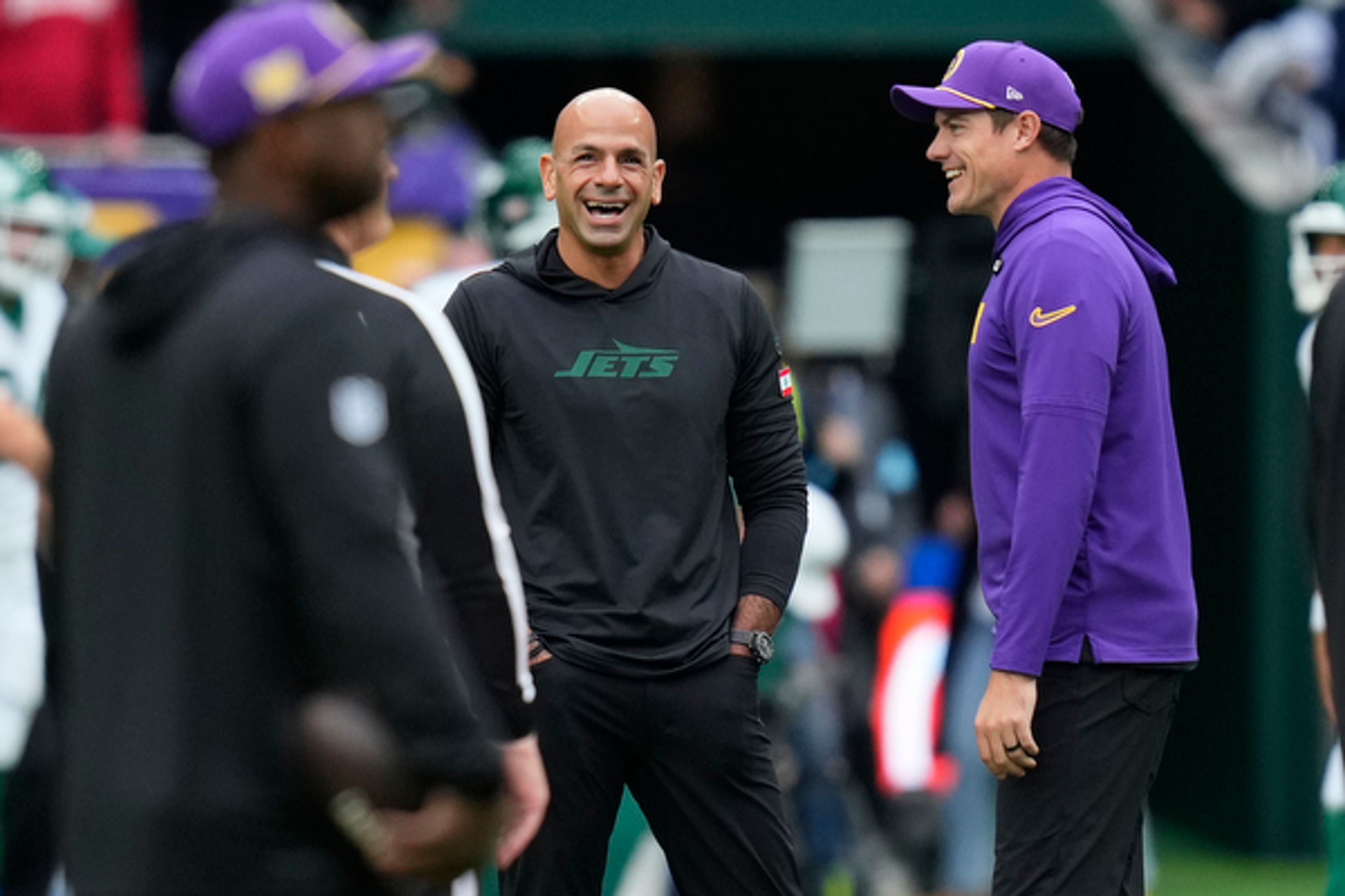 Minnesota Vikings head coach Kevin O'Connell, right, talks with New York Jets head coach Robert Saleh before an NFL football game, Sunday, Oct. 6, 2024, at the Tottenham Hotspur stadium in London. (AP Photo/Kirsty Wigglesworth)