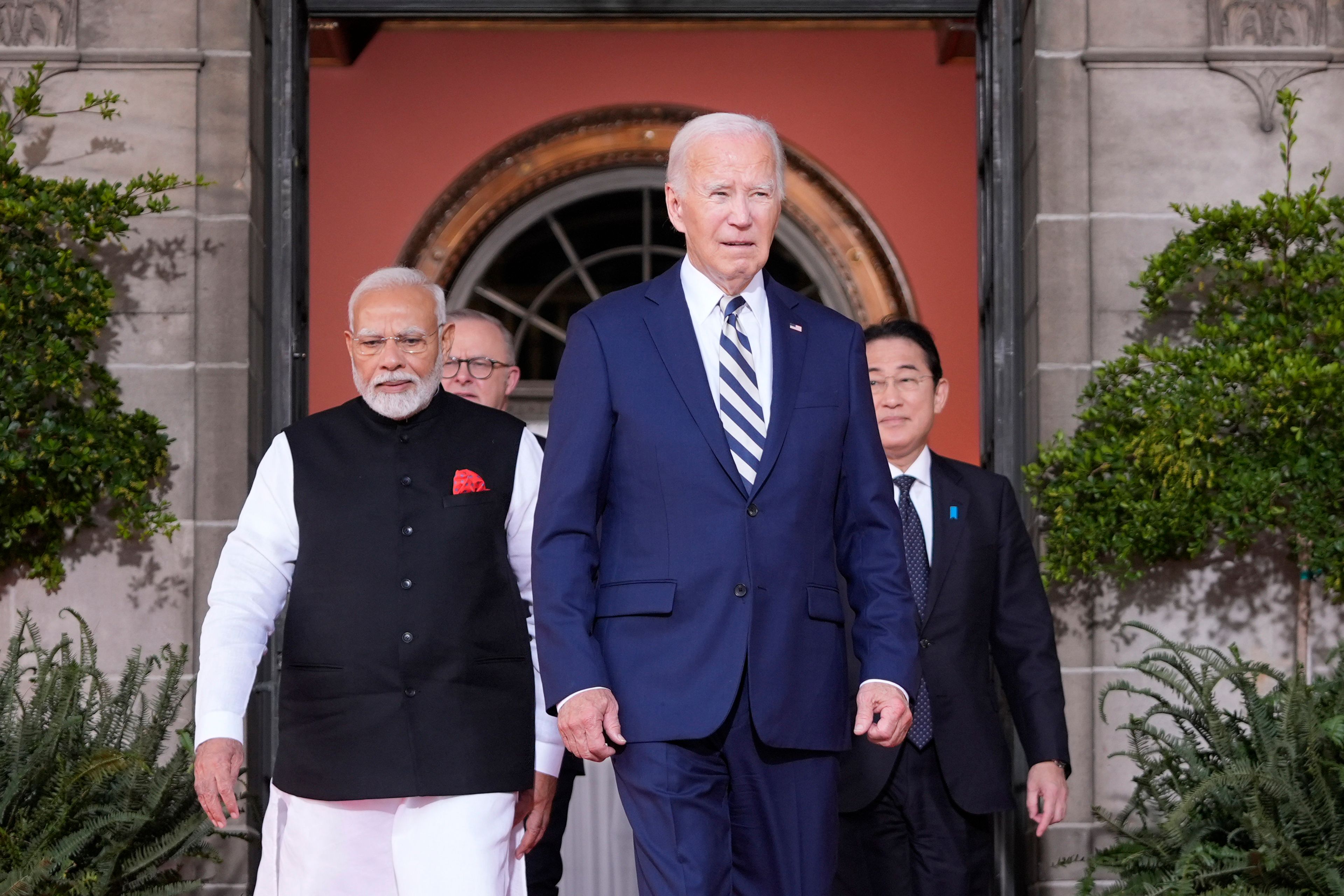 President Joe Biden walks to a group photo with from left, India's Prime Minister Narendra Modi, Australia's Prime Minister Anthony Albanese, Biden, and Japan's Prime Minister Fumio Kishida, at the Quad leaders summit at Archmere Academy in Claymont, Del., Saturday, Sept. 21, 2024. (AP Photo/Mark Schiefelbein)