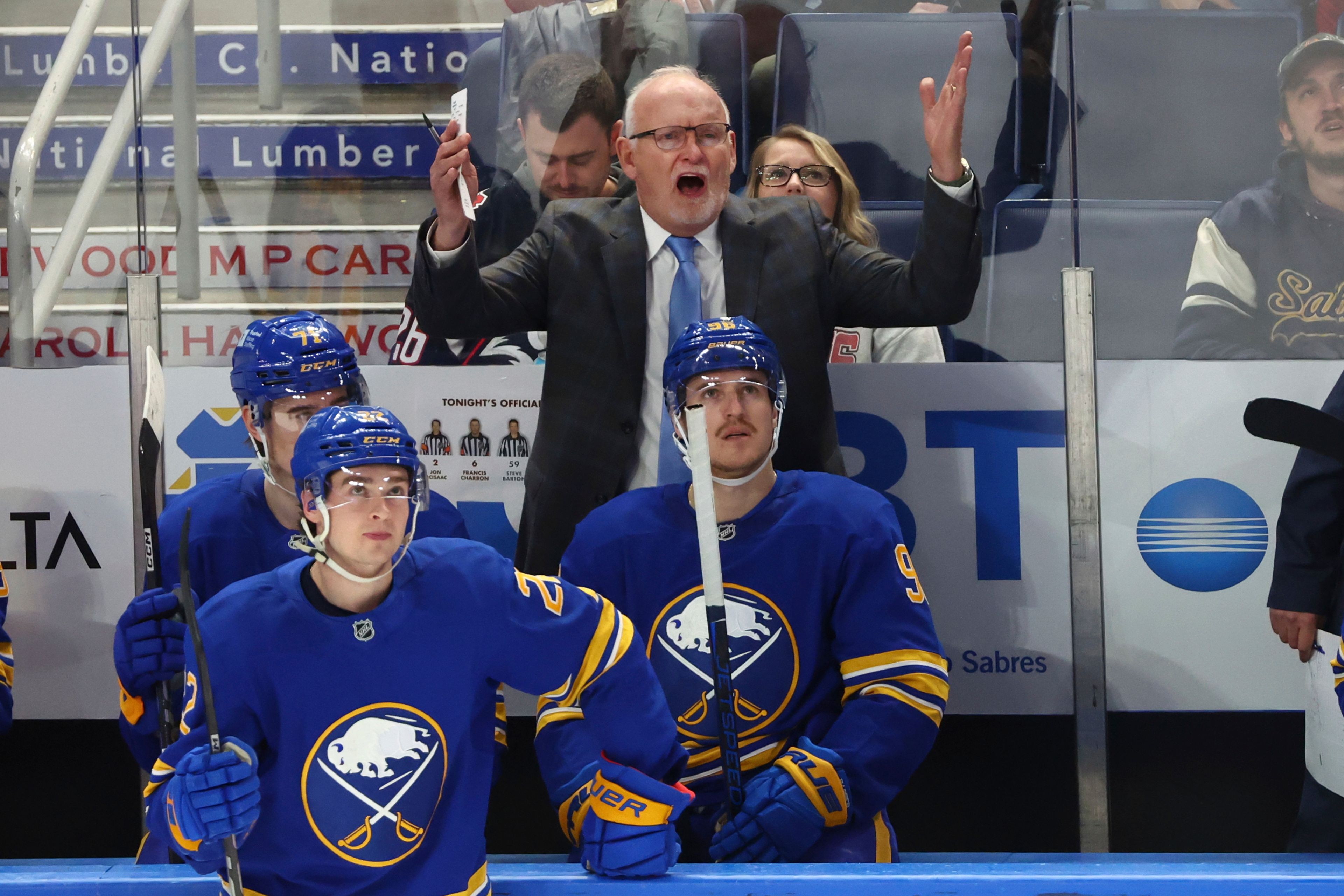 Buffalo Sabres head coach Lindy Ruff, center top, reacts after a goal was called back for goaltender interference during the third period of an NHL hockey game against the St. Louis Blues, Thursday, Nov. 14, 2024, in Buffalo, N.Y. (AP Photo/Jeffrey T. Barnes)