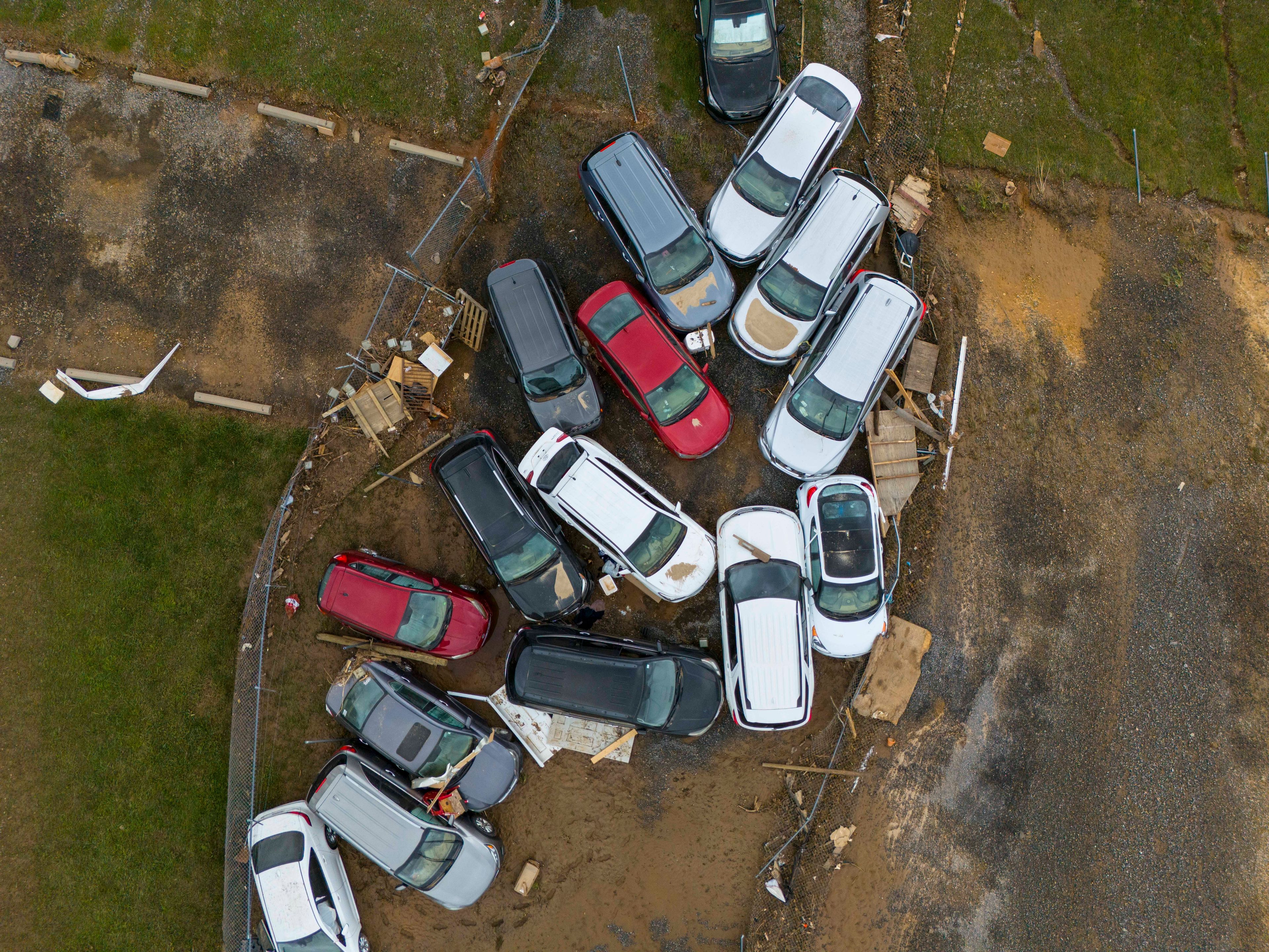 FILE - Vehicles and debris that were caught in a flash flood from Hurricane Helene rest on the side of the road near the Swannanoa River, Tuesday, Oct. 1, 2024, in Swannanoa, N.C. (AP Photo/Mike Stewart, File)