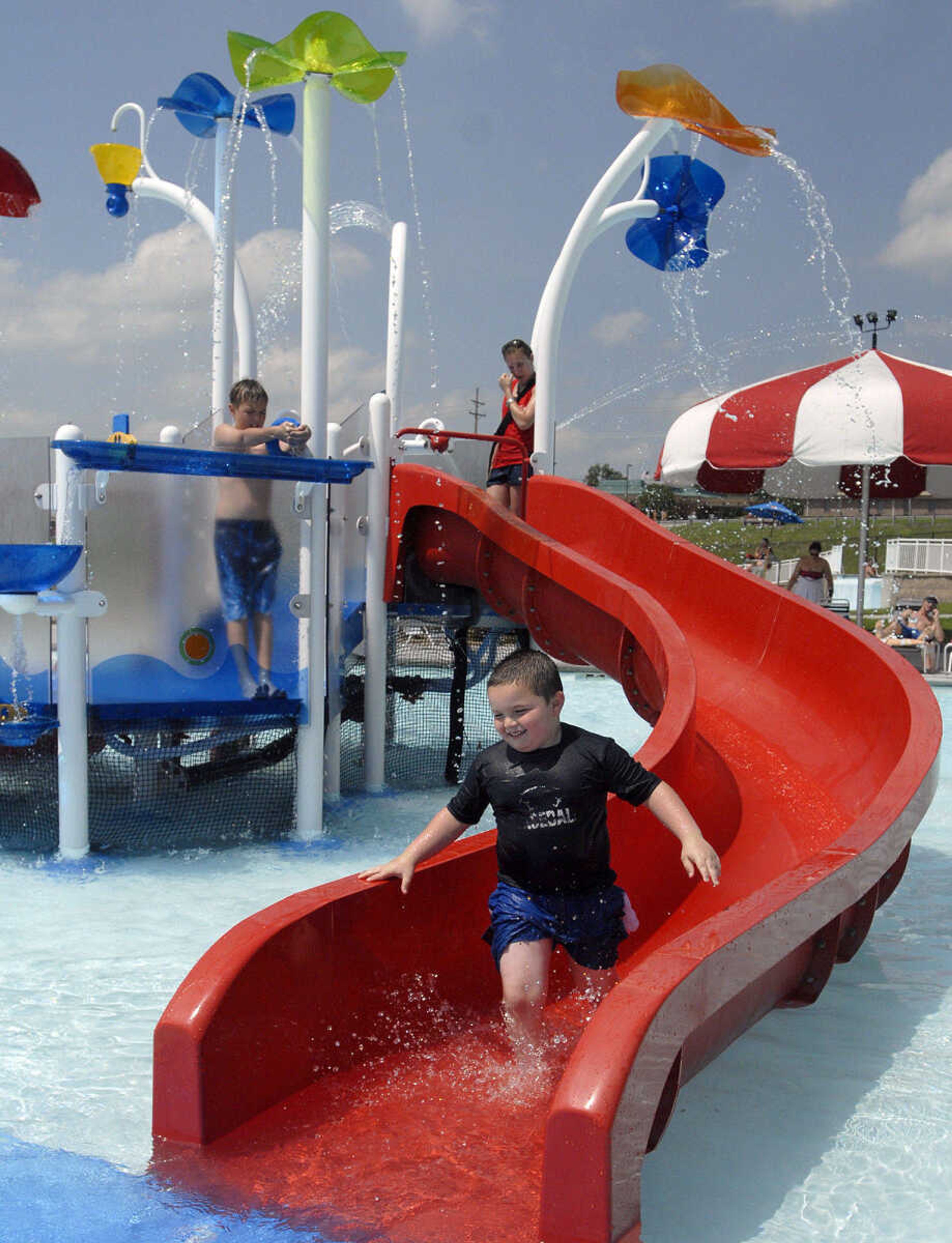 LAURA SIMON~lsimon@semissourian.com
Colton Jones, 6, runs down the slide in the play pool Saturday, May 28, 2011 during opening day of Cape Splash Family Aquatic Center in Cape Girardeau.