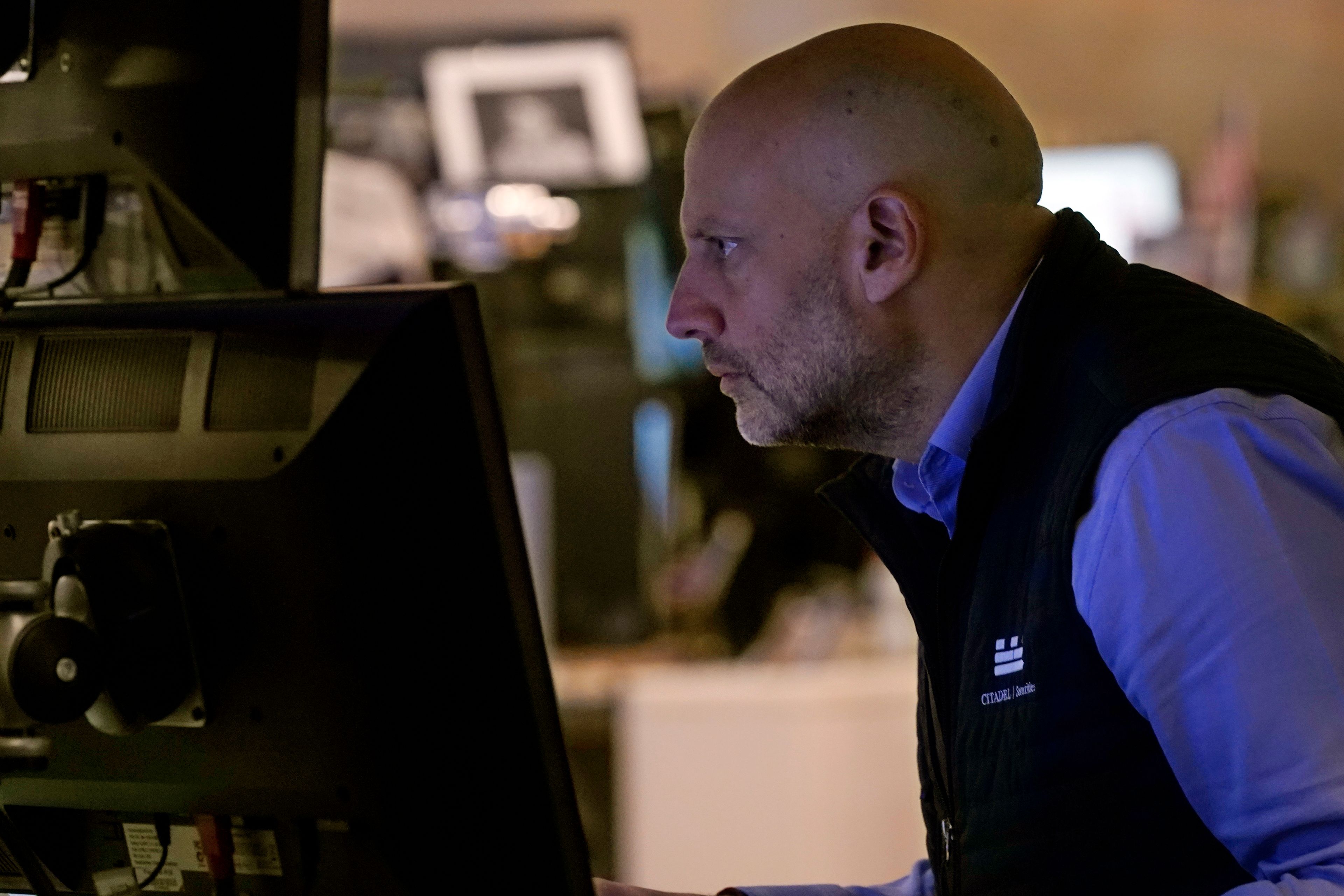 Specialist Meric Greenbaum work at his post on the floor of the New York Stock Exchange, Monday, Nov. 4, 2024. (AP Photo/Richard Drew)