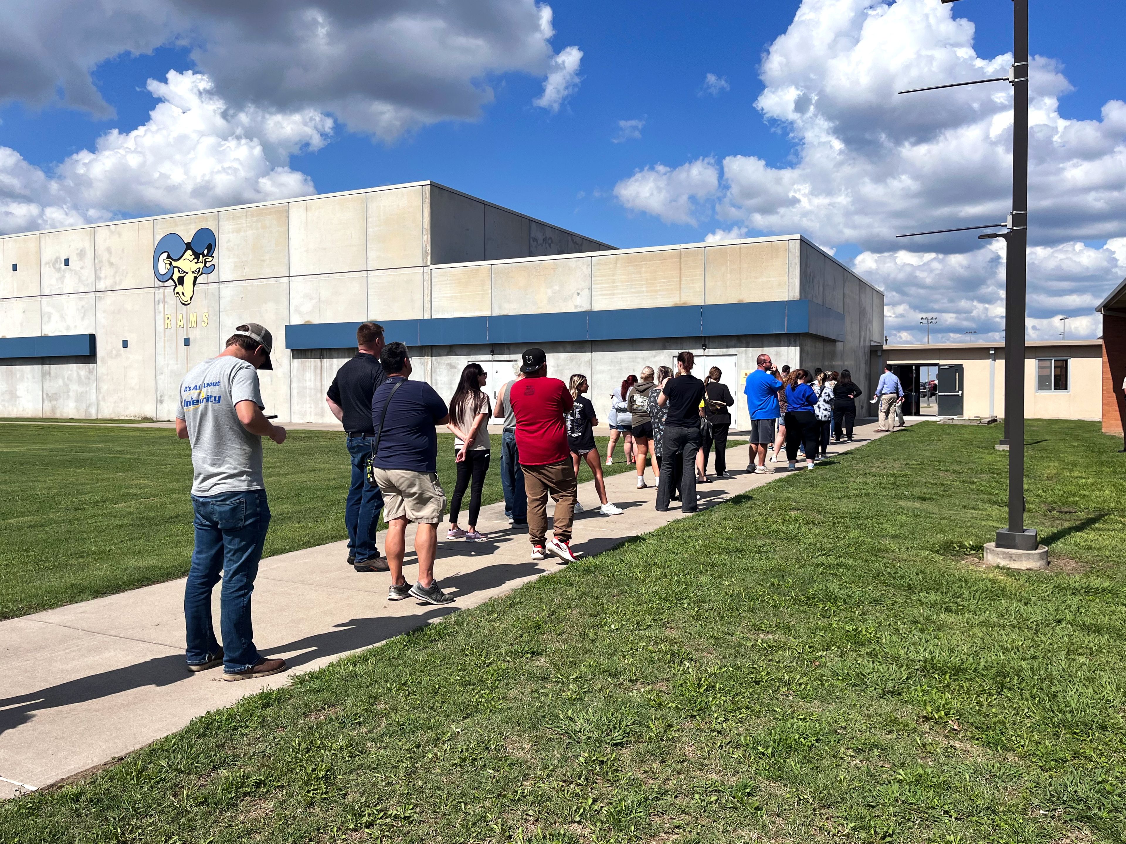 Parents wait in line to pick up their children Thursday, Sept. 26, outside of Scott City School.