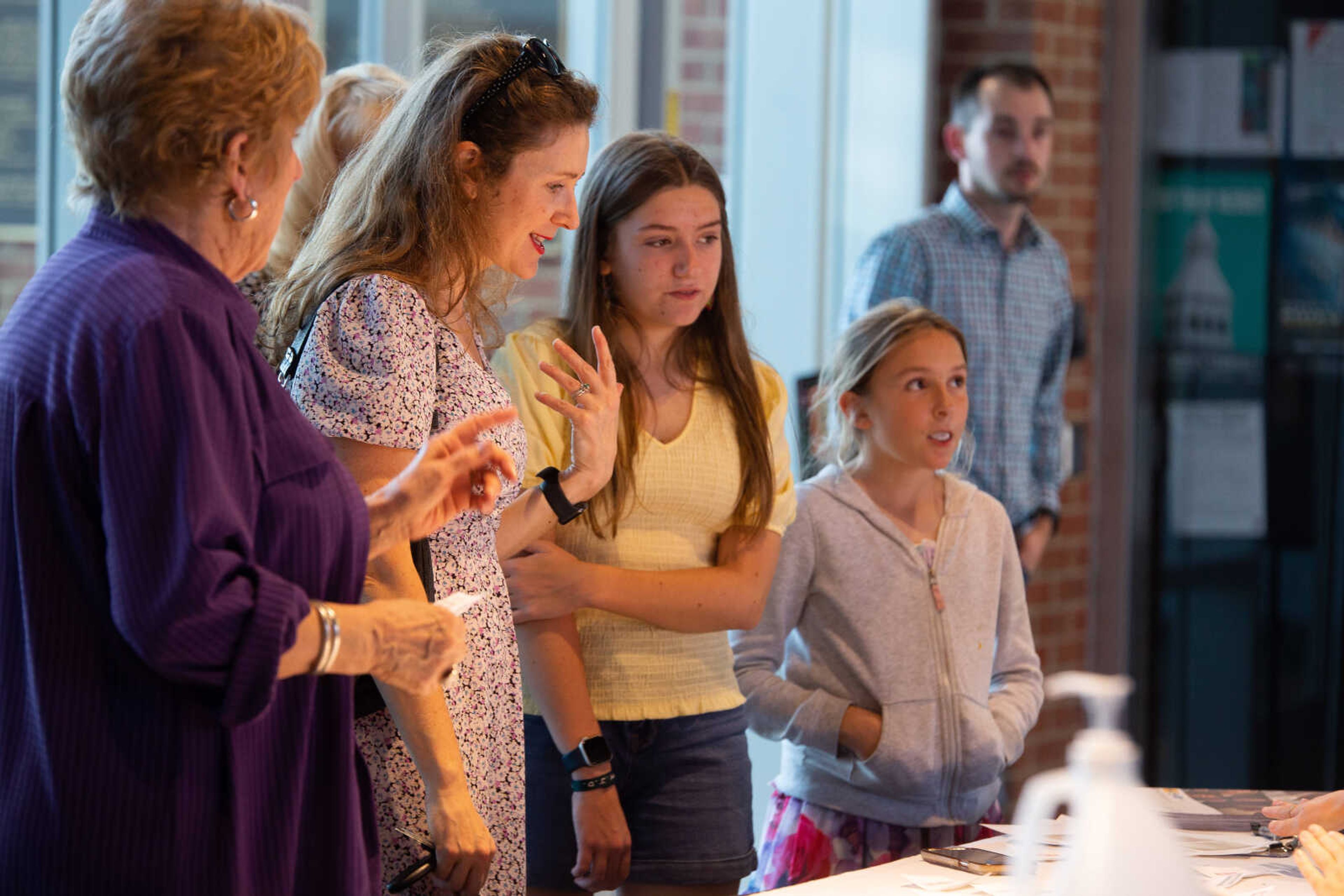 Victoria Rust, left, and daughters Katya and Liza Rust arrive at the B Magazine diffence makers recognition ceremony.