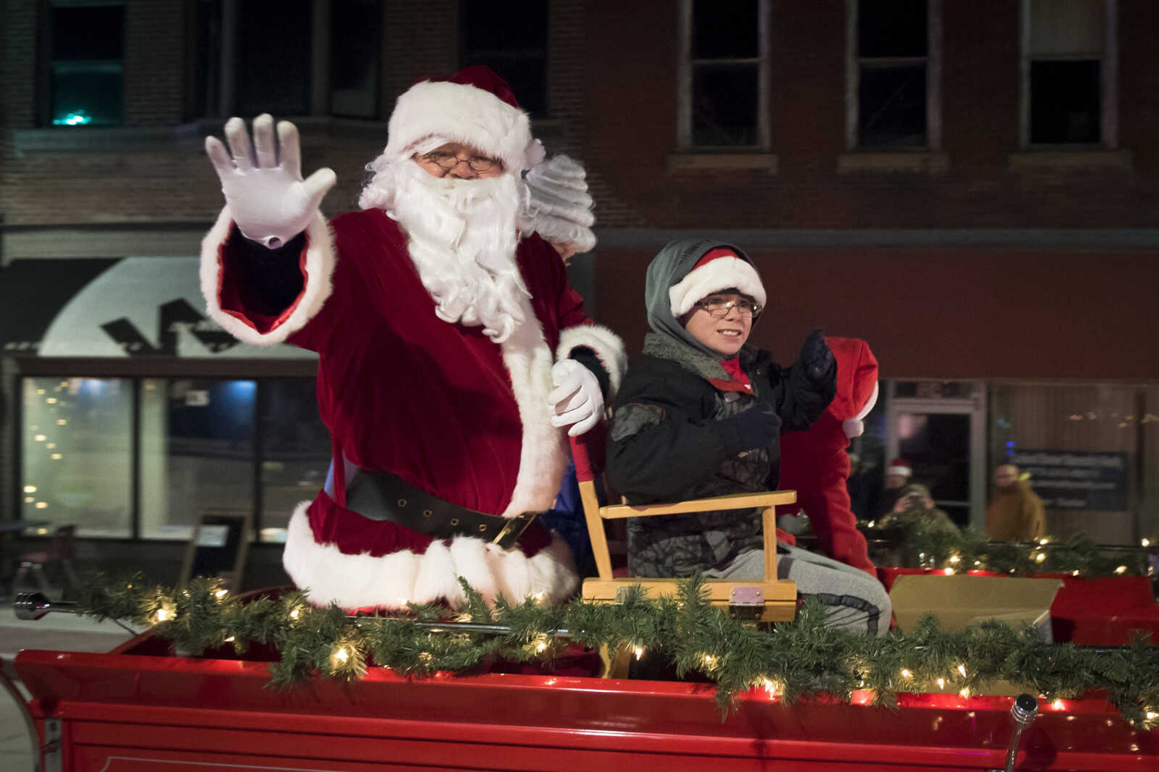 Santa Claus waves to the crowd during the 28th annual Parade of Lights on Dec. 1, 2019, in Cape Girardeau.