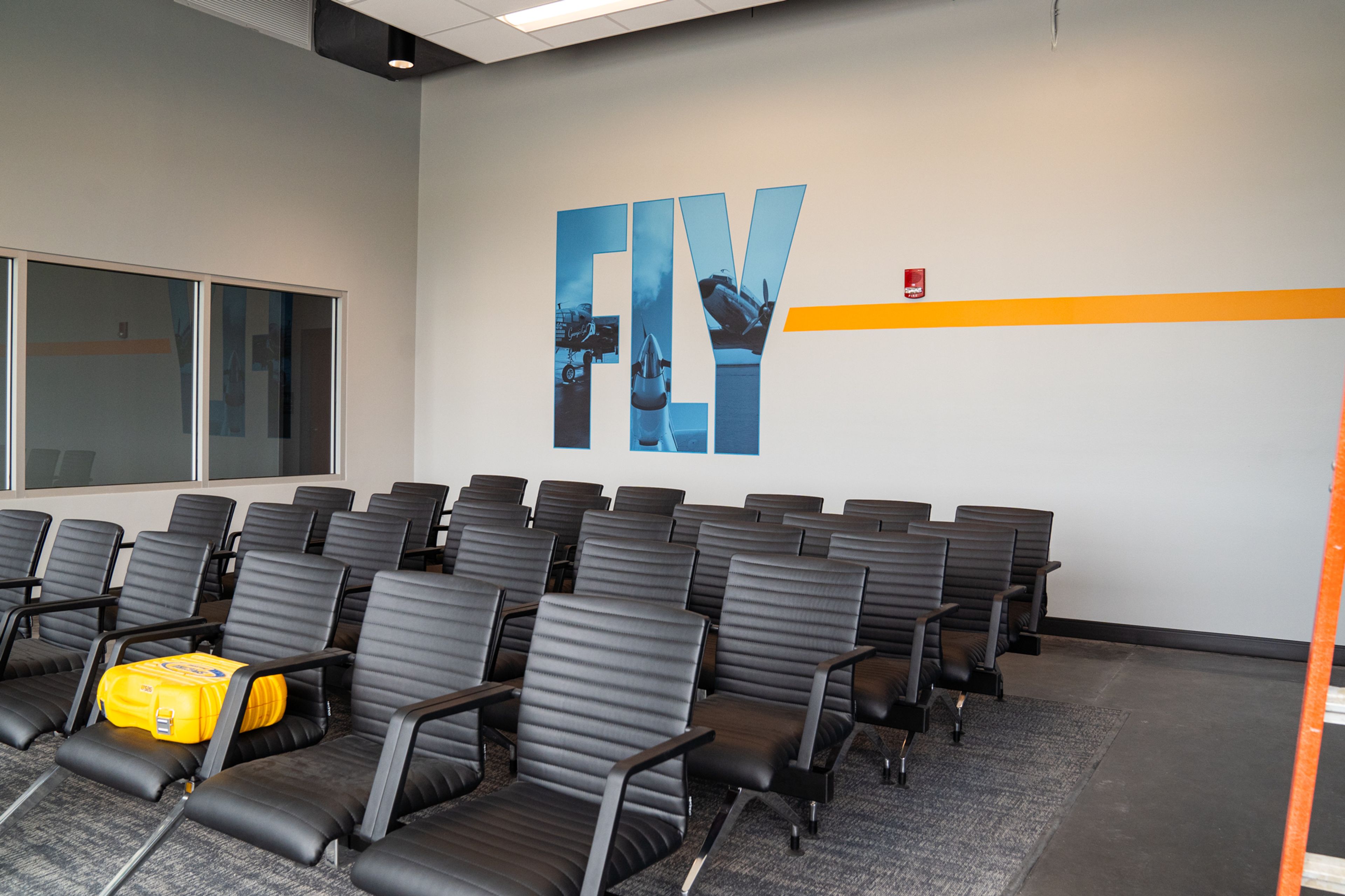 Another room allows guest to wait for their flight and a view of the runway after their security check.