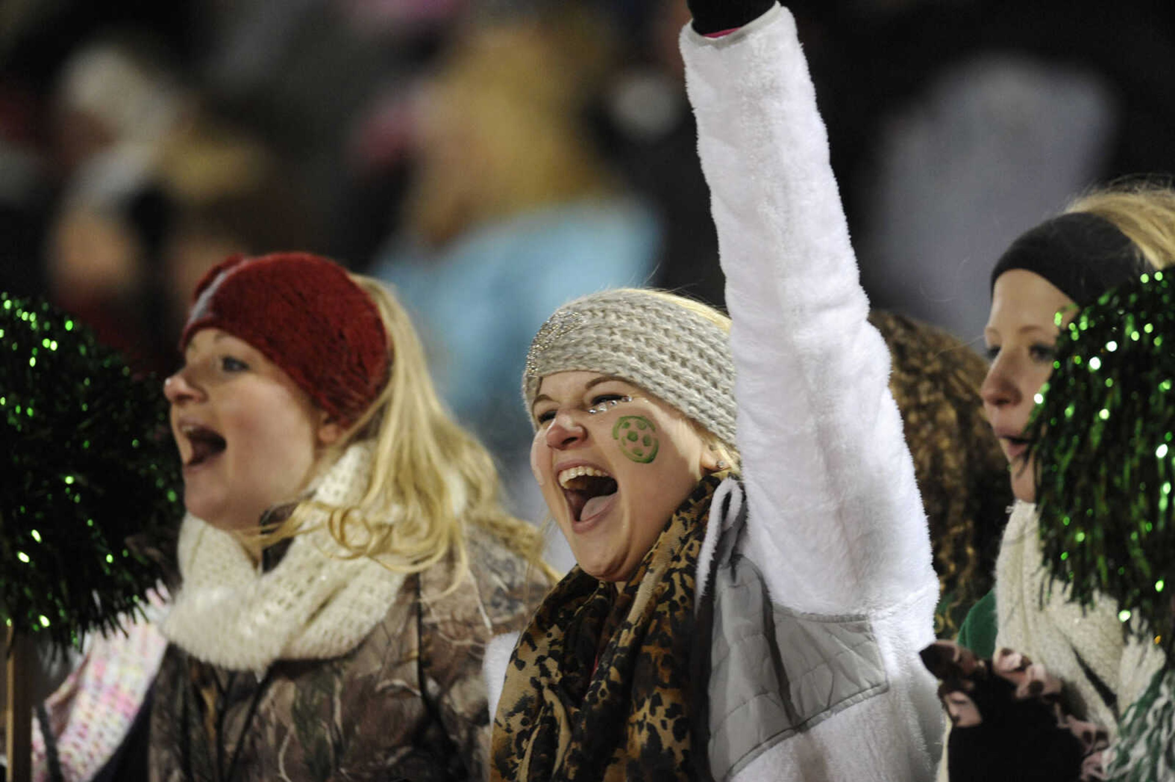 Perryville fans Taylor Cissell, right, and Maddie Steffens cheer at the end of the Class 2 State Semifinal against St. Pius X at Blue Springs High School Friday, Nov. 14, 2014. (Glenn Landberg)