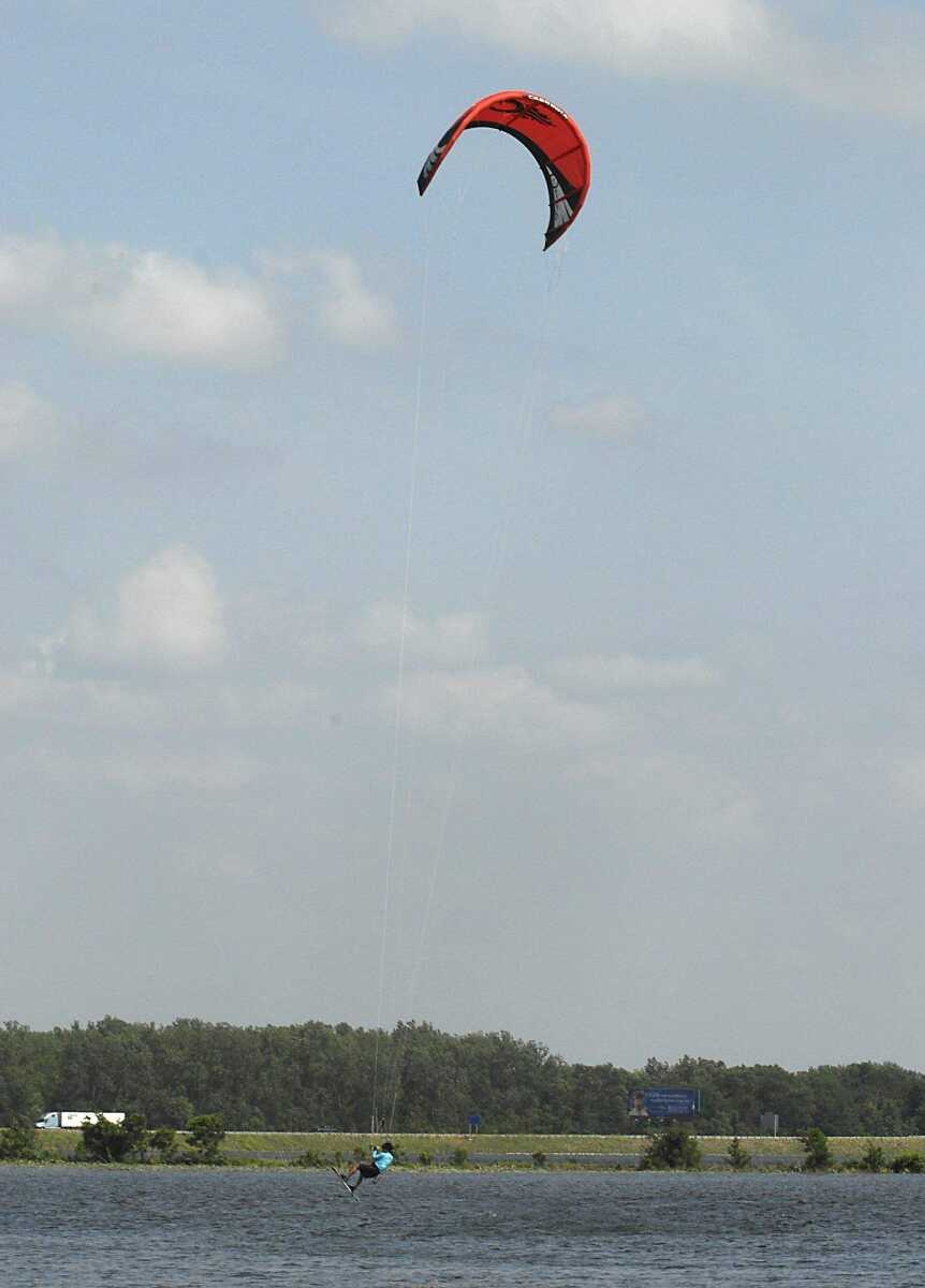 FRED LYNCH ~ flynch@semissourian.com
Dr. Kee Park let the wind lift his kiteboard off a flooded field Friday.