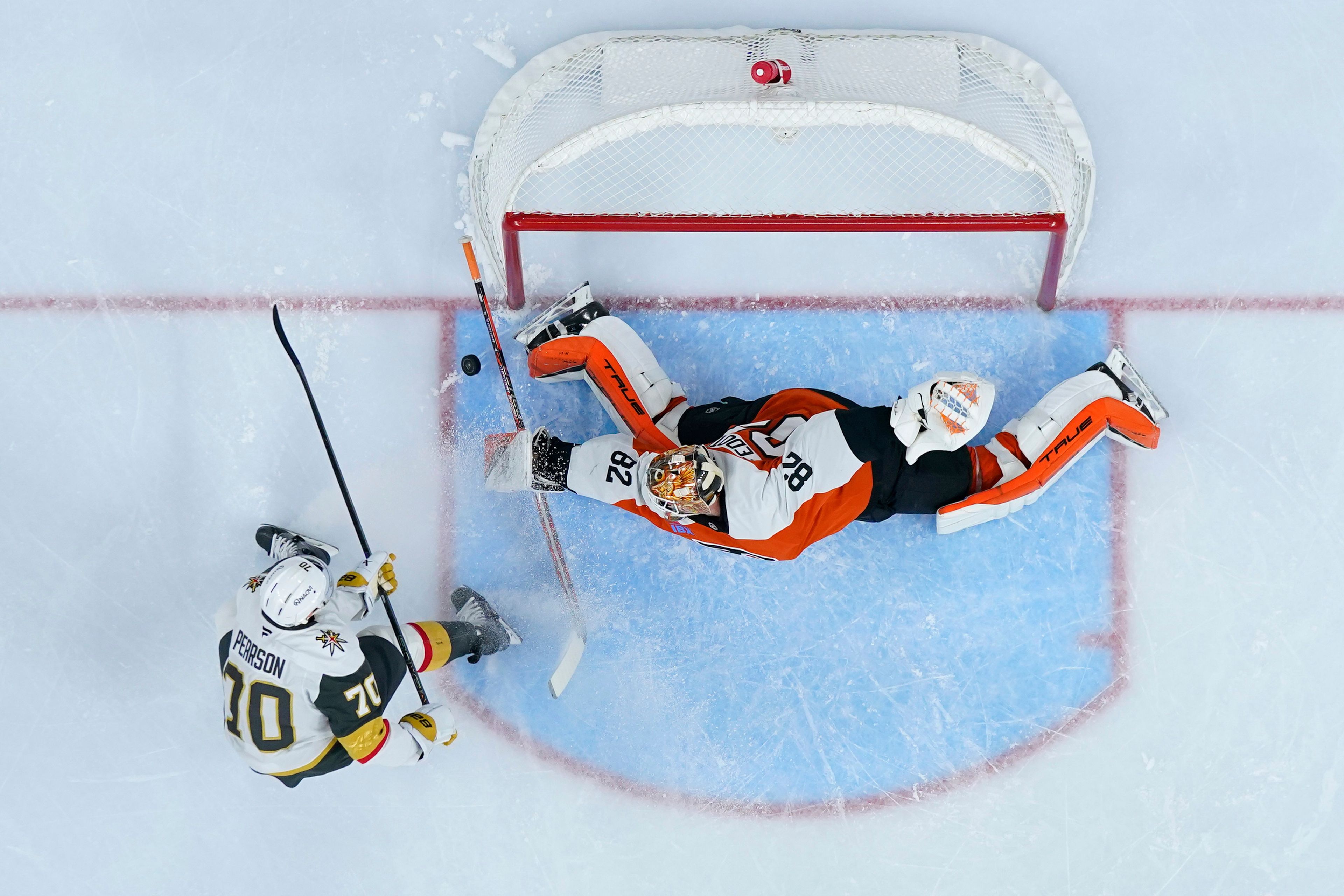 Vegas Golden Knights' Tanner Pearson, left, cannot get a shot past Philadelphia Flyers' Ivan Fedotov during the first period of an NHL hockey game, Monday, Nov. 25, 2024, in Philadelphia. (AP Photo/Matt Slocum)