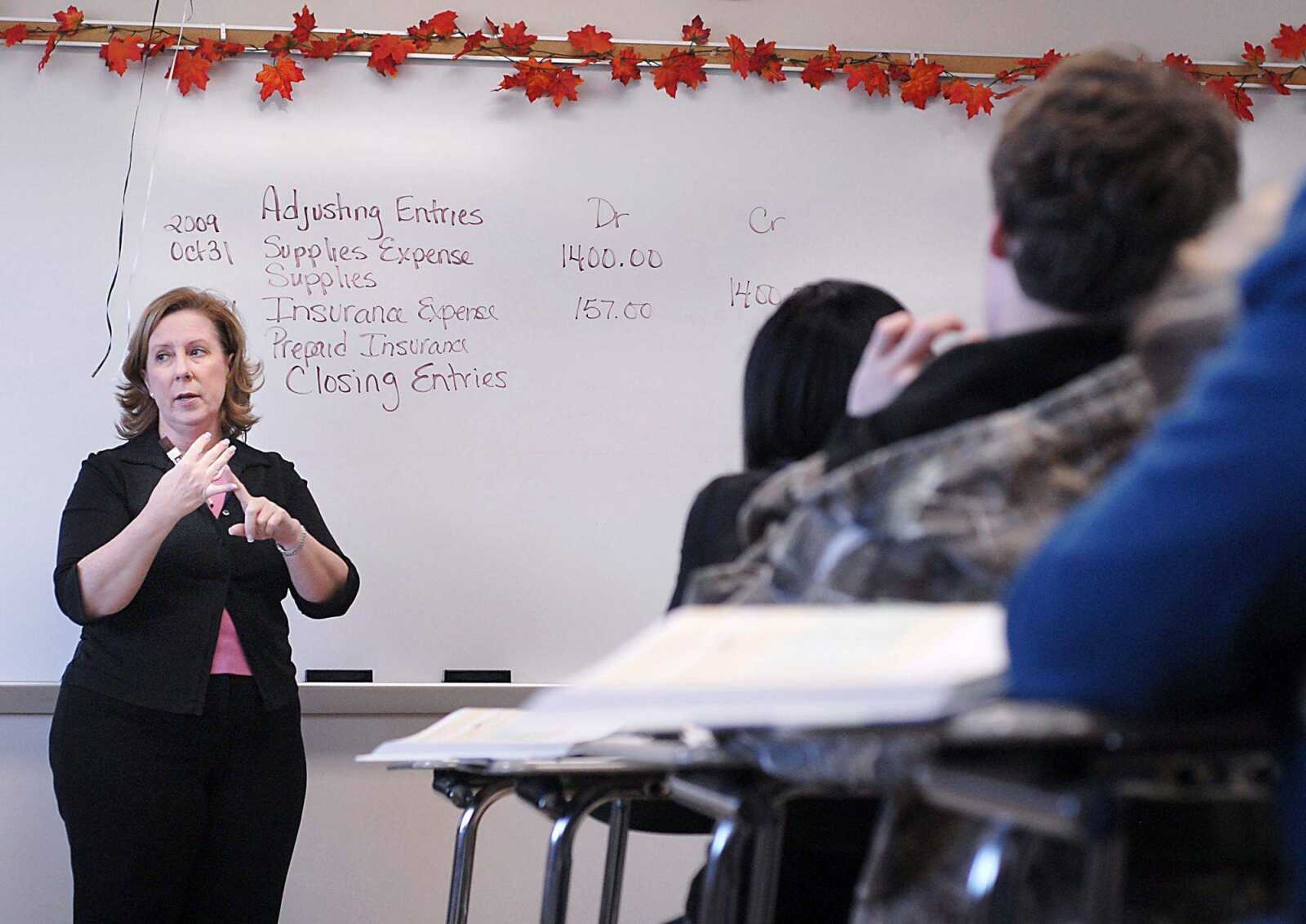 Central High School teacher Patty Wamble reviews debiting and crediting accounts with upperclassmen for an accounting test Thursday in Cape Girardeau. (Kit Doyle)