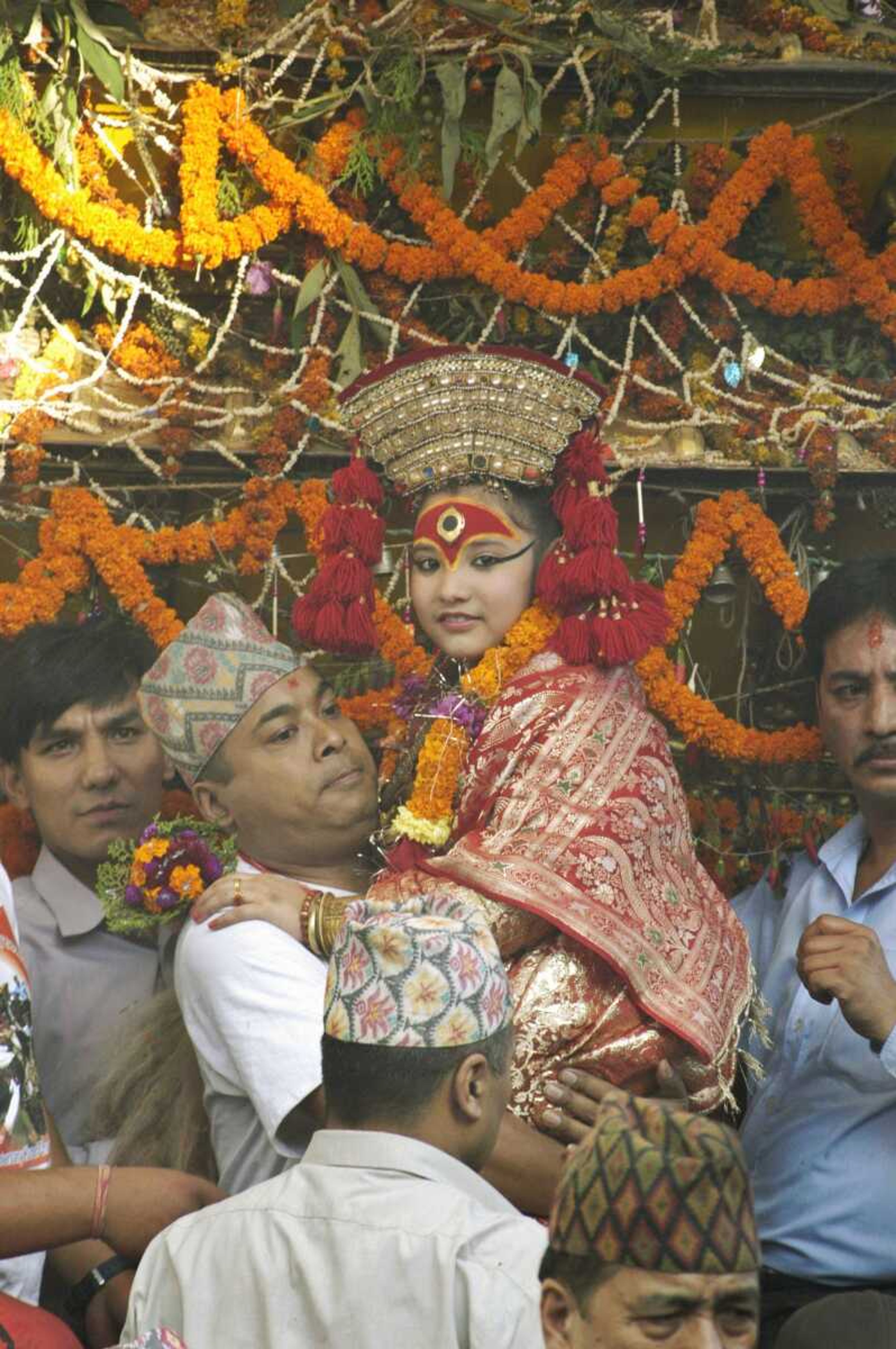 Nepal's living goddess, locally known as a kumari, was taken around the city on a chariot during the Indra Jatra festival in Katmandu. (BINOD JOSHI ~ Associated Press)