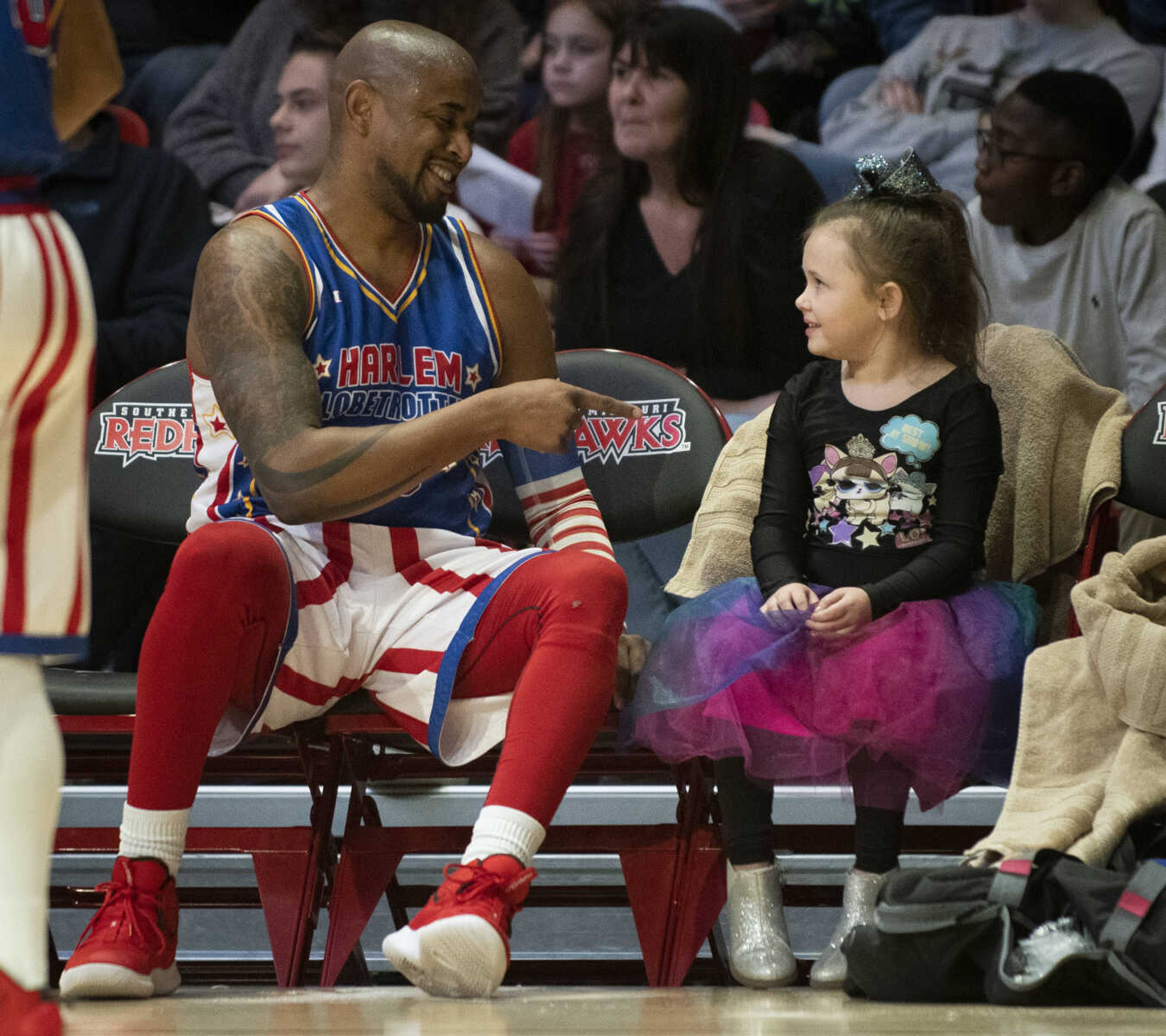 Harlem Globetrotter guard Scooter Christensen (16) meets with Kylie Holmes of Sikeston, 7, during the Globetrotters' visit to the Show Me Center on Wednesday, Jan. 16, 2019, in Cape Girardeau. This was Kylie's first Globetrotters' game.