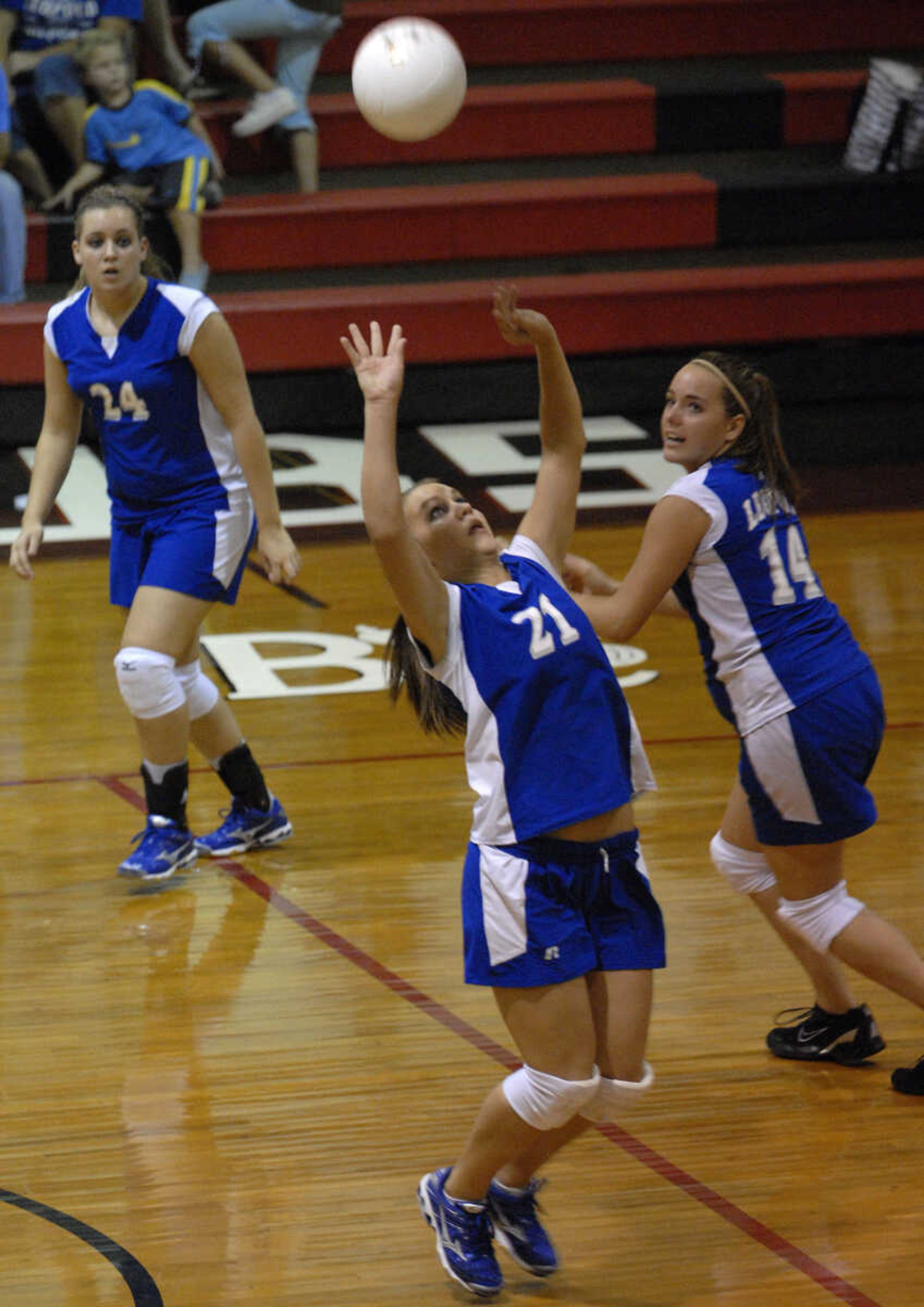 FRED LYNCH ~ flynch@semissourian.com
Leopold's Lauren Seiler sets the ball for teammates Mallory James, right, and Shelby Vandeven during the second game Friday at Bell City.