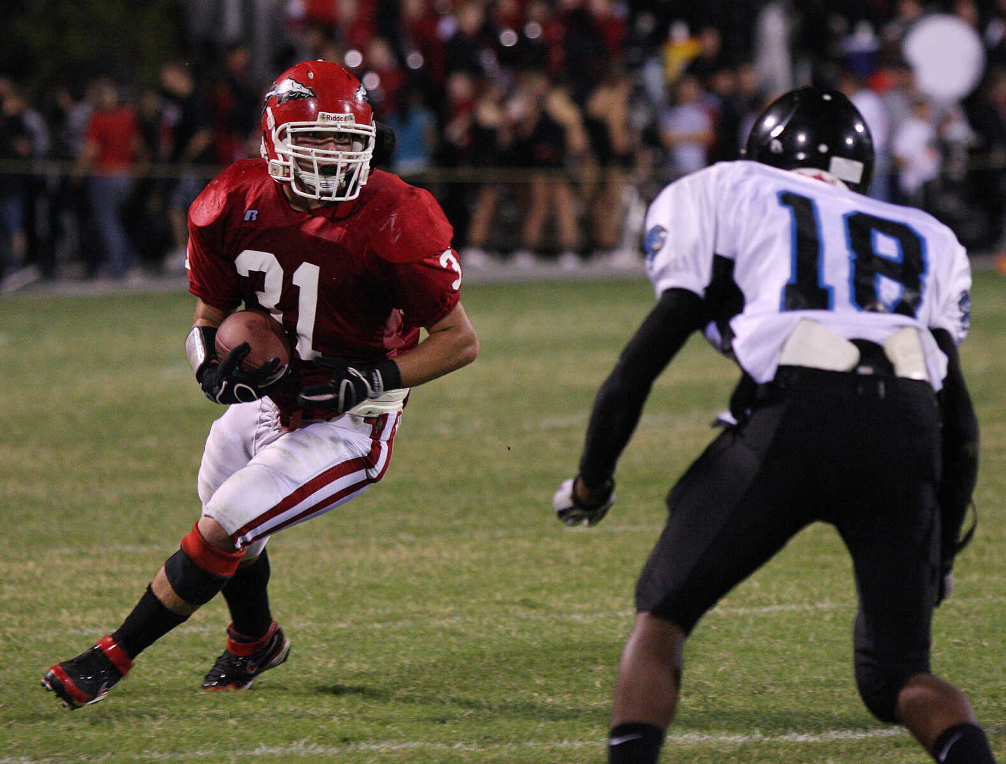 Jackson's Cole Rodgers looks to gain some yards past Gateway Tech's Demeco Williams.