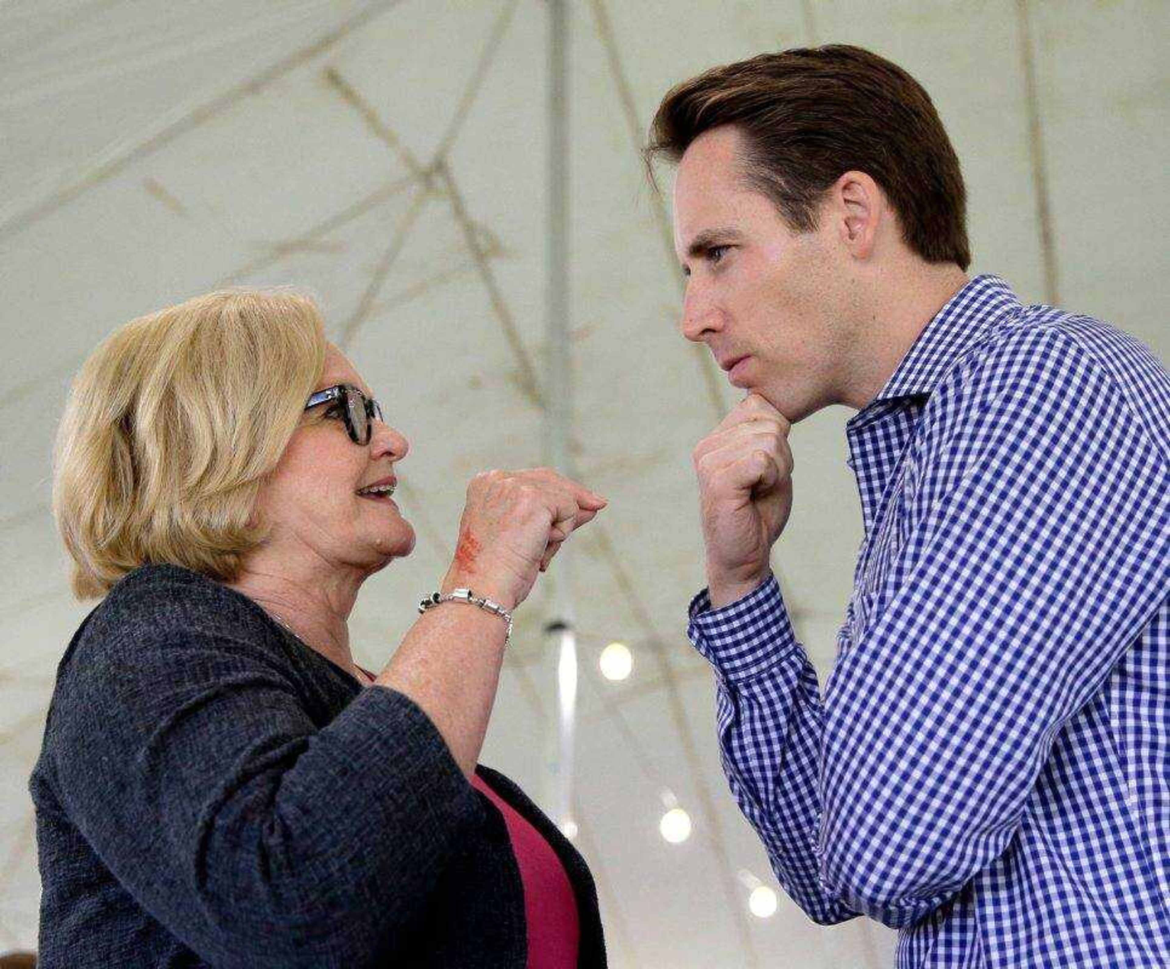 Democratic U.S. Sen. Claire McCaskill, left, talks with Republican Missouri Attorney General Josh Hawley on Aug. 17 in Sedalia, Missouri.