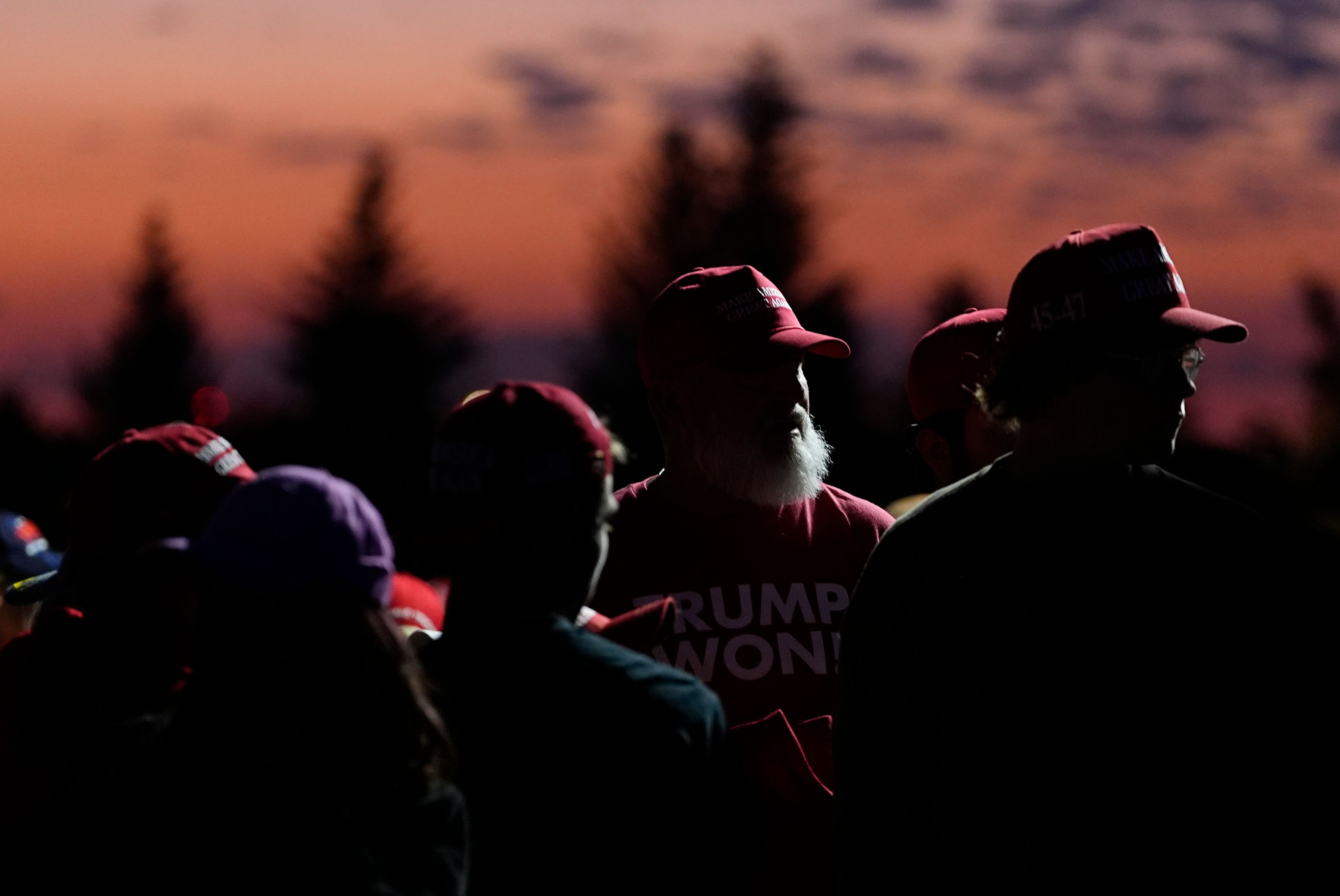 Supporters queue up as the sun rises to hear Republican presidential nominee former President Donald Trump speak at a campaign rally at the Gaylord Rockies Resort and Convention Center Friday, Oct. 11, 2024, in Aurora, Colo. (AP Photo/David Zalubowski)