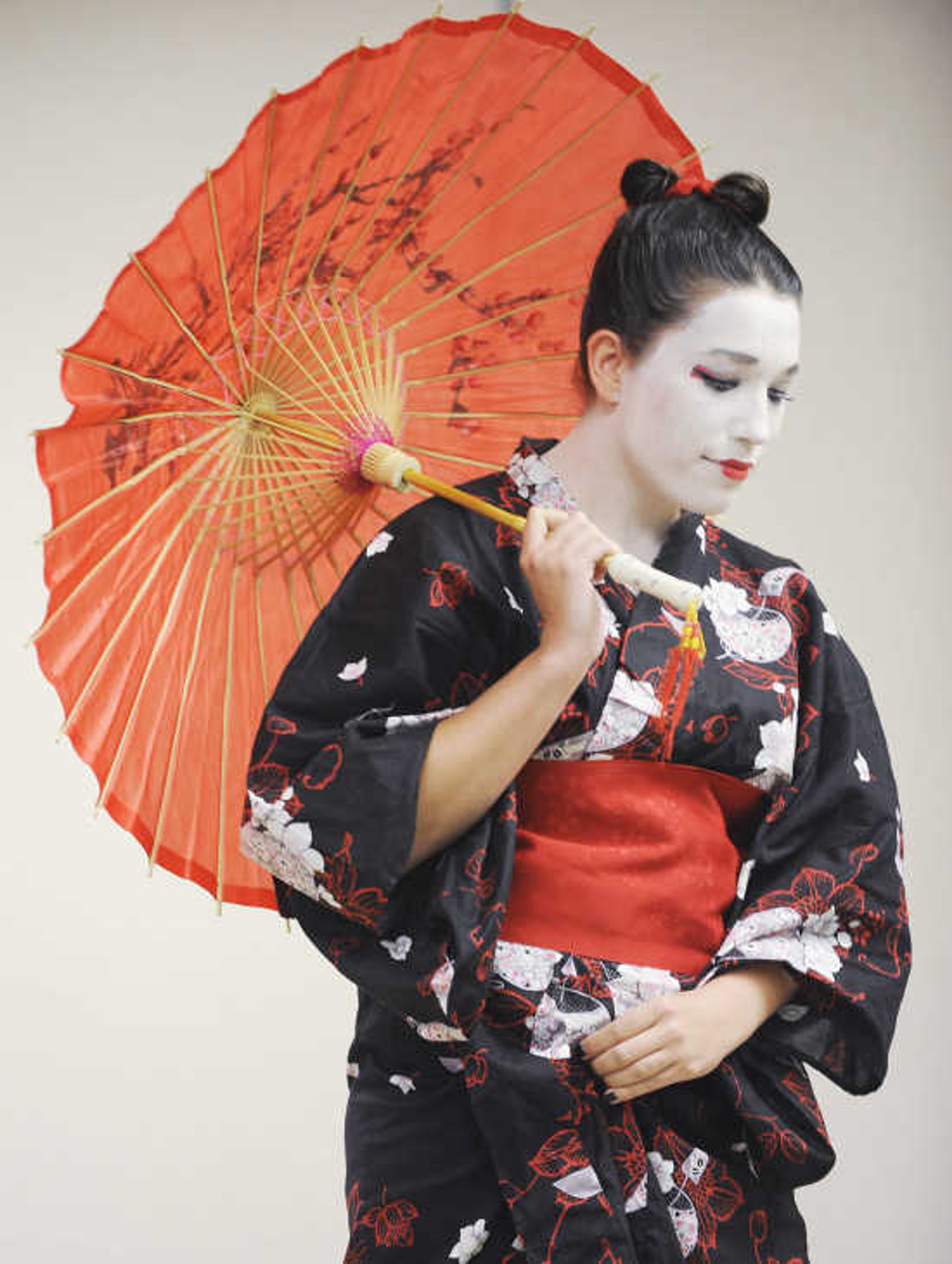 Jessica Coomer dressed as geisha for the Cape Comic Con 2012 costume contest at the Osage Center in Cape Girardeau Saturday, April 21, 2012.