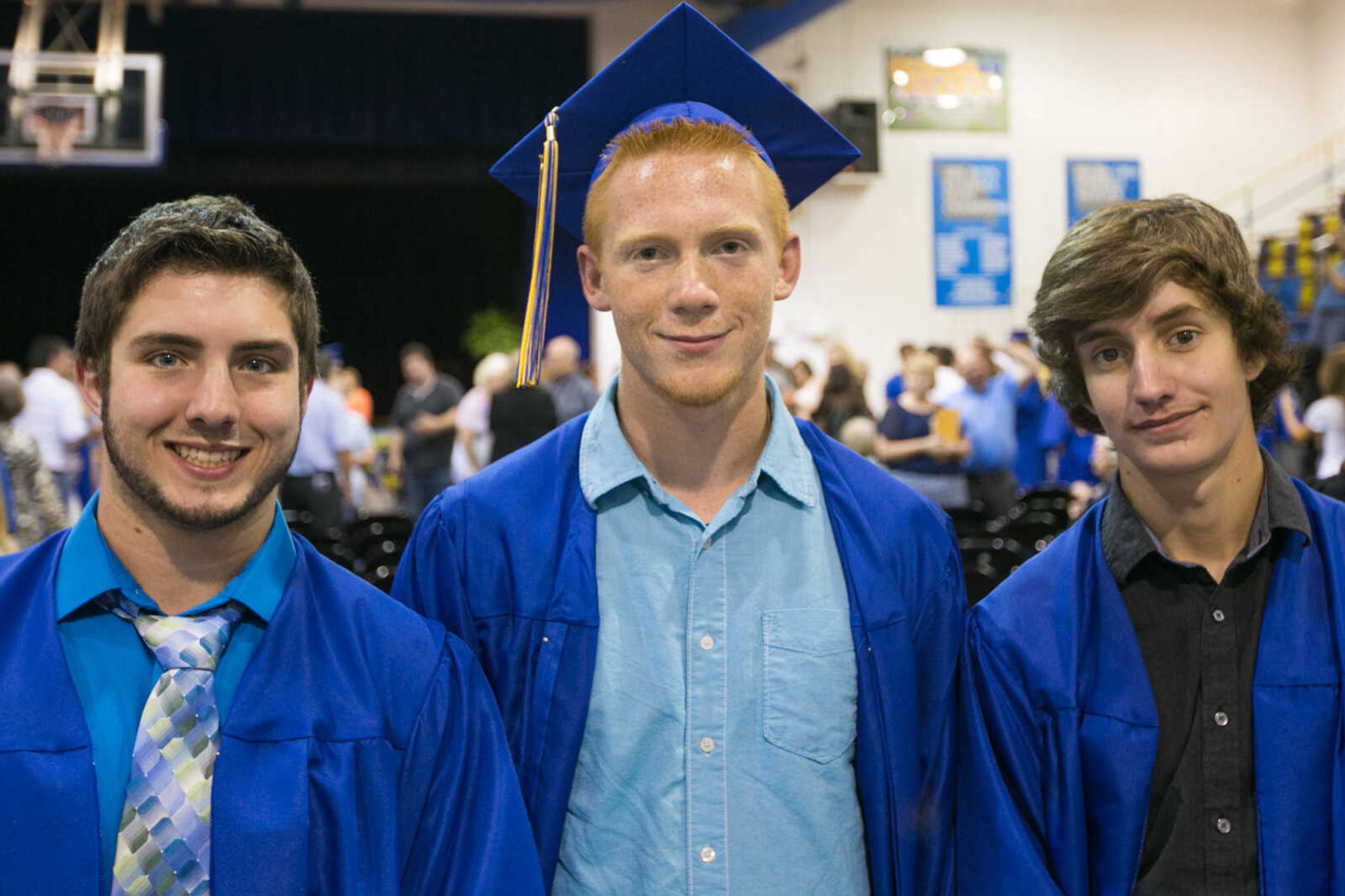 GLENN LANDBERG ~ glandberg@semissourian.com

Jake Elders, Caleb Sykes and A.J. Bollinger pose for a photo during the Scott City commencement Sunday, May 17, 2015 at Scott City High School.