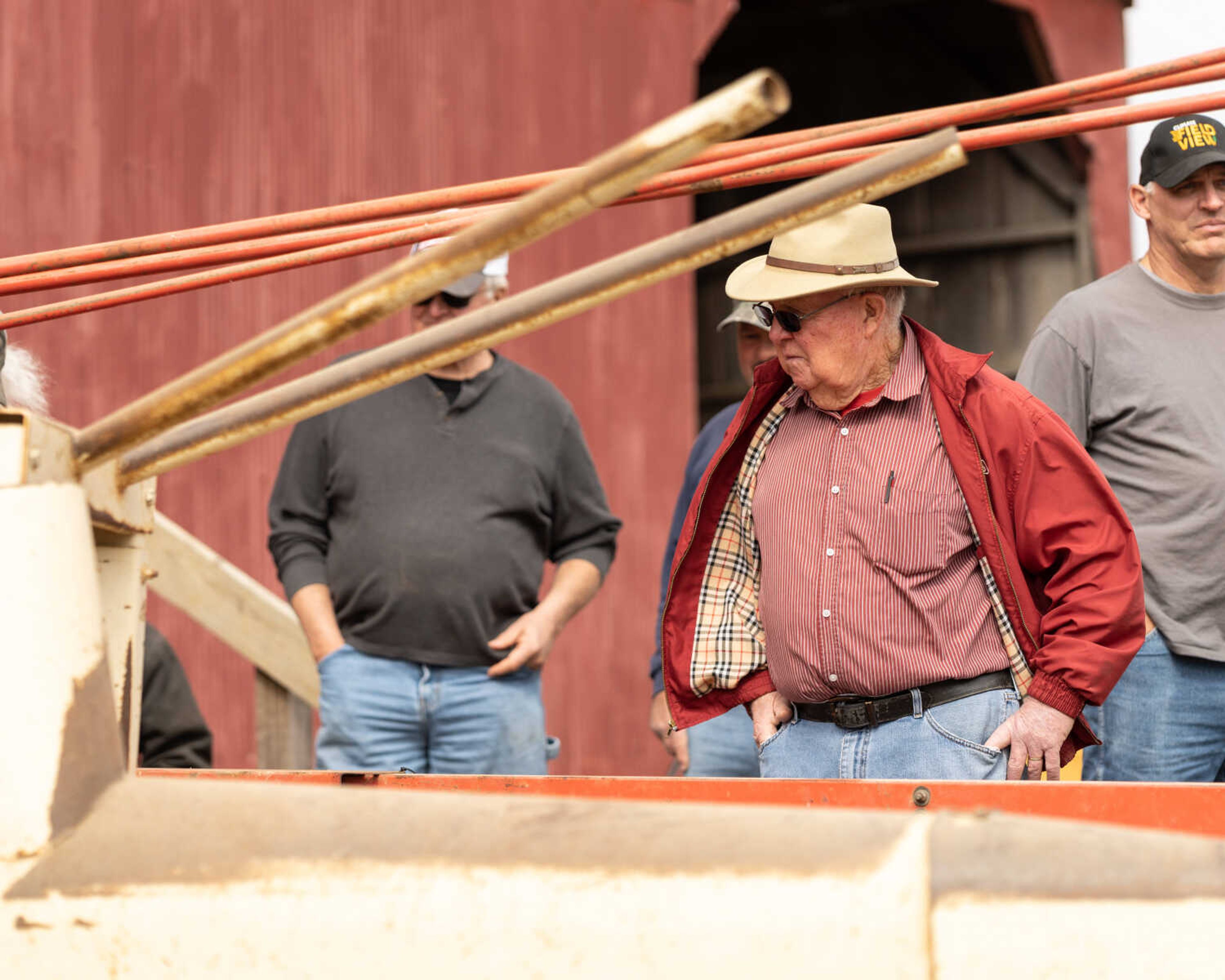 Auctioneer Charley Mangels examines a piece of farm equipment while taking a break from auctioneering at a sale in the Fruitland area on March 5, 2022. Charley has been an auctioneer since the 1970s.