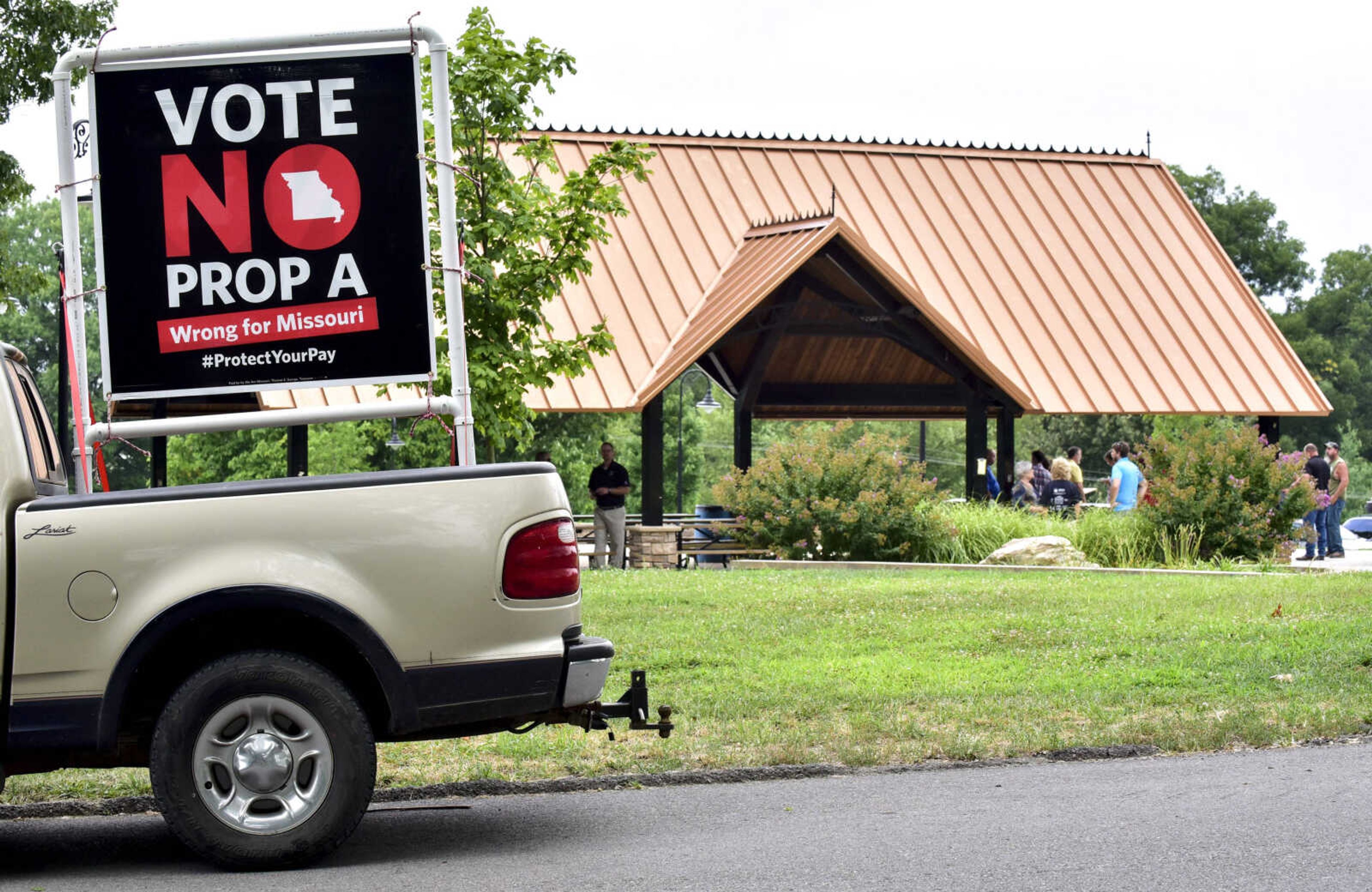 A "Vote NO on Prop A" sign sits in the back of a truck outside of a rally July 23 at Capaha Park in Cape Girardeau.