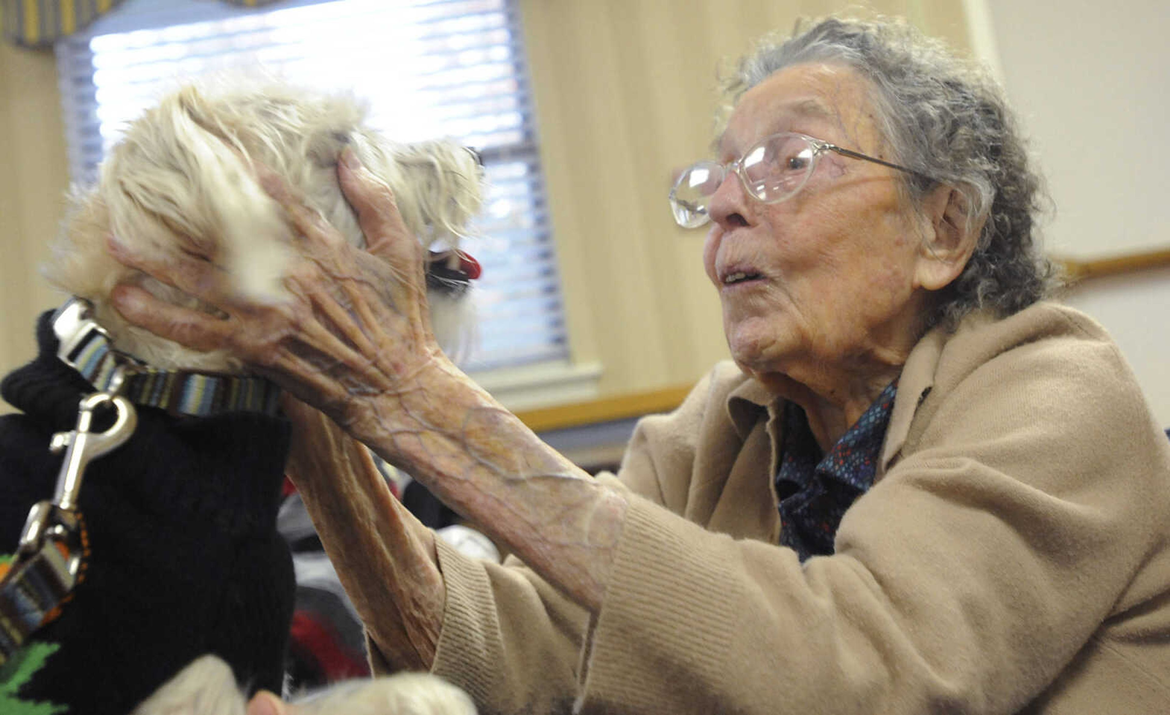 Nora White, 102, left, visits with Charlie during the Howl-oween Pet Parade, Friday, October 26, at the Chaffee Nursing Center, in Chaffee. This is the first time the event, where pets and their owners dressed up in costumes to visit residents at the center, has been held. Registration was free but donations were accepted for the Safe Harbor Animal Sanctuary in Jackson.