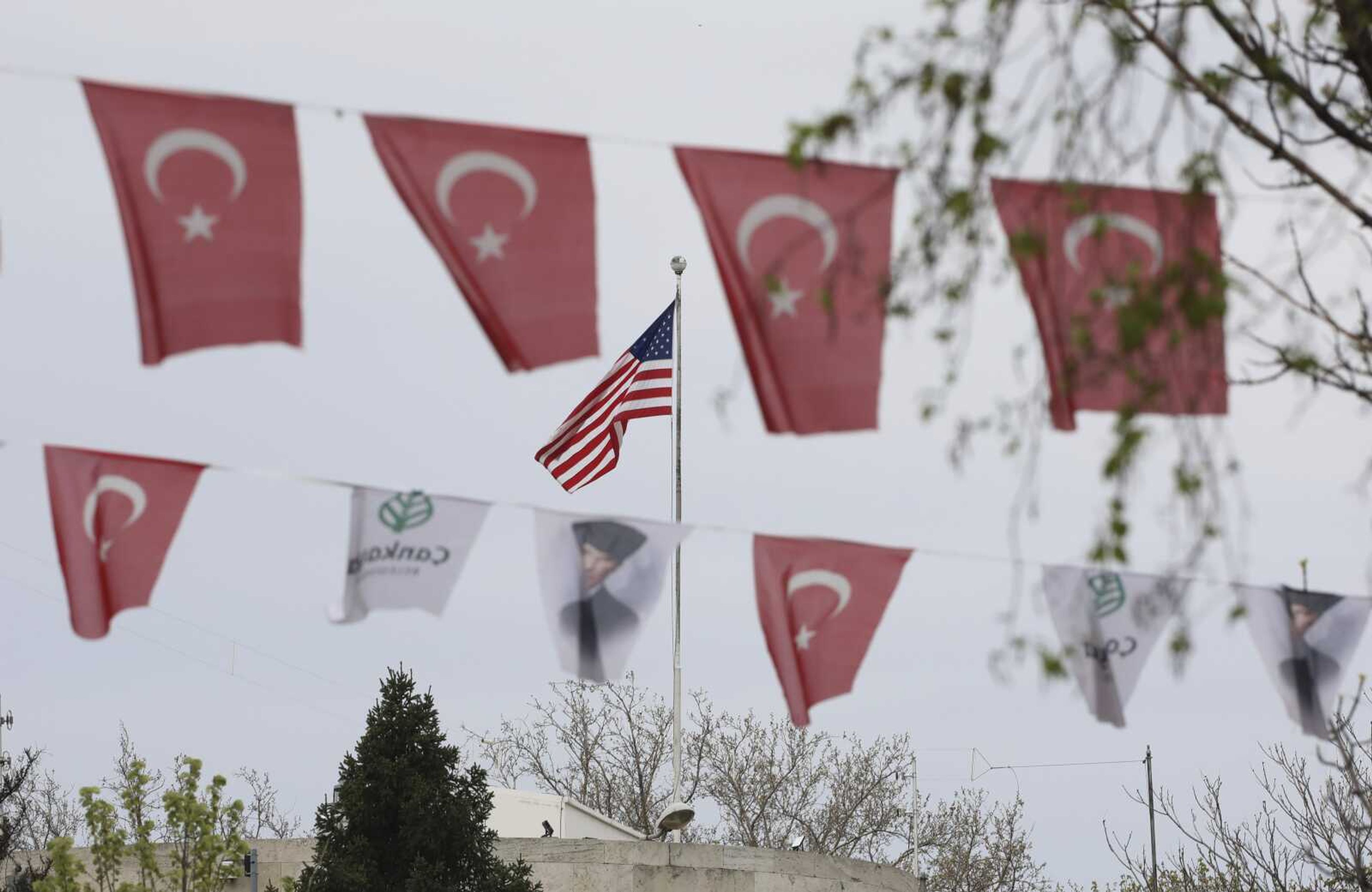 Turkish flags and banners depicting Mustafa Kemal Ataturk, the founder of modern Turkey, decorate a street outside the U.S. Embassy on Sunday in Ankara, Turkey.