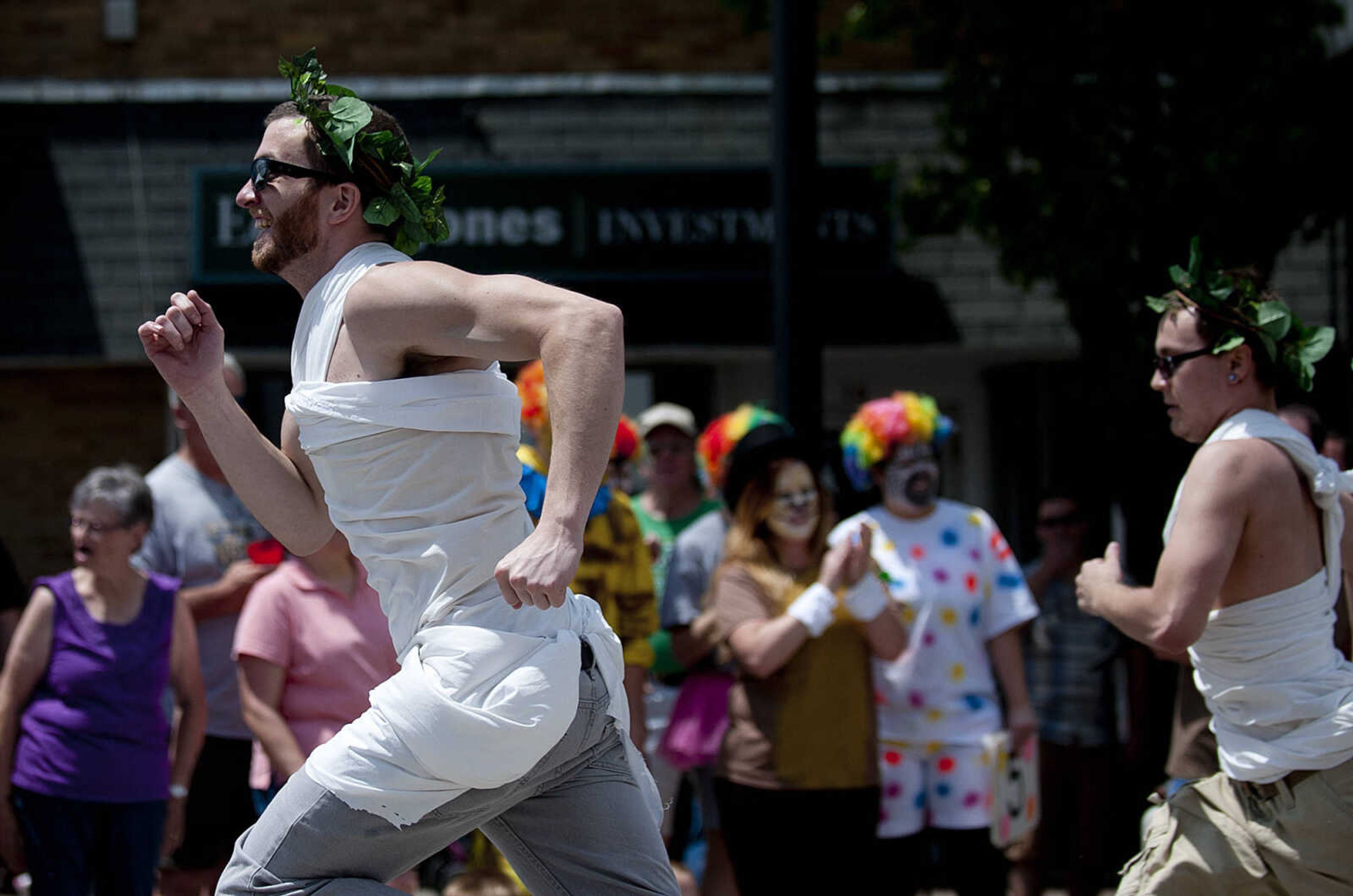 Taylor Old, left, and Michael Horn race for the finish line as the Animal House team sponsored by Mary Jane, Burgers and Brew, compete in the Perryville Mayfest Bed Races Saturday, May 10, in Perryville, Mo.