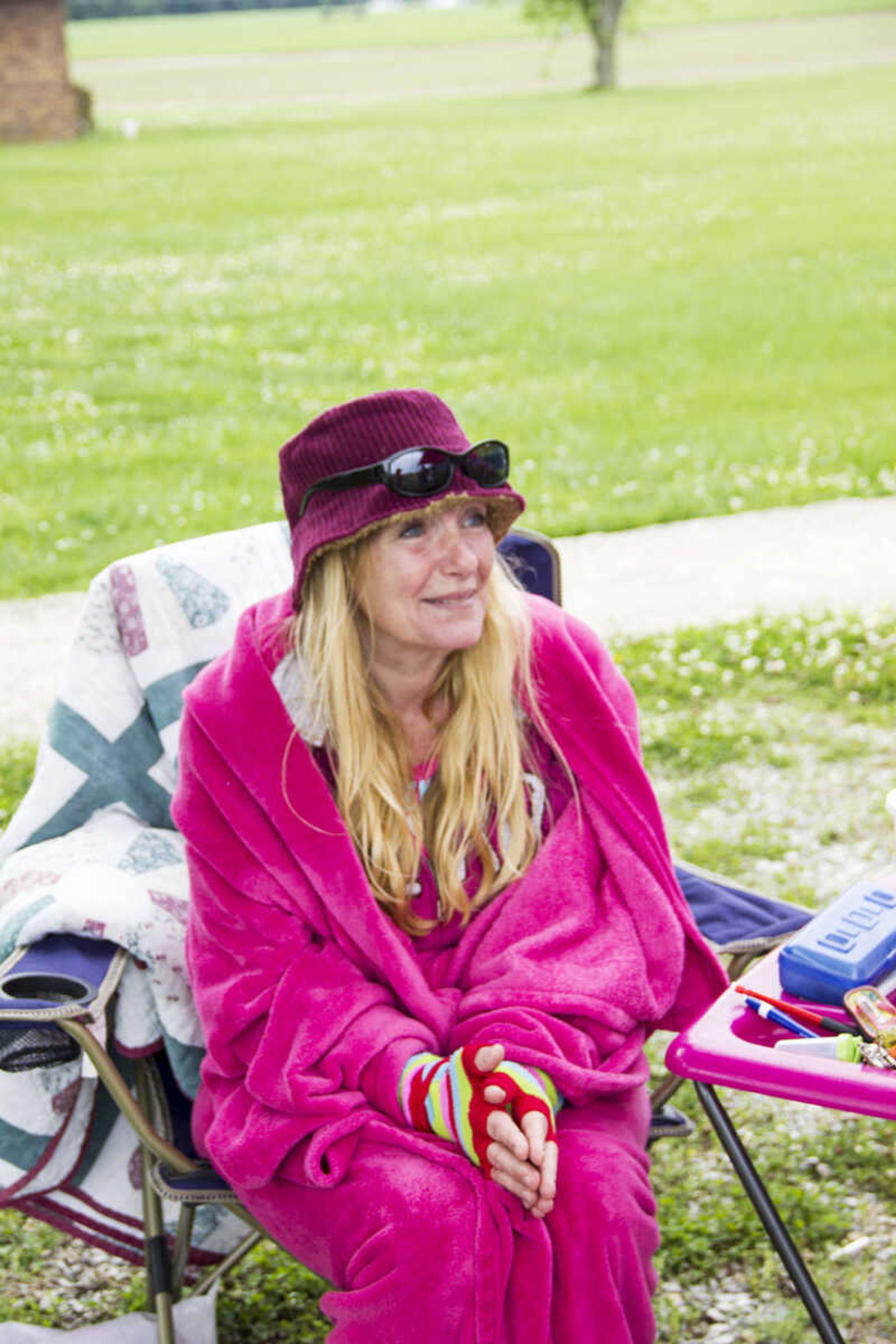 CAROL KELLISON ~ photo@semissourian.com

Amy McDonald tries to stay warm at her seventh year of participating in the 100-mile yard sale on Thursday May 22, 2015 in Advance, Missouri.