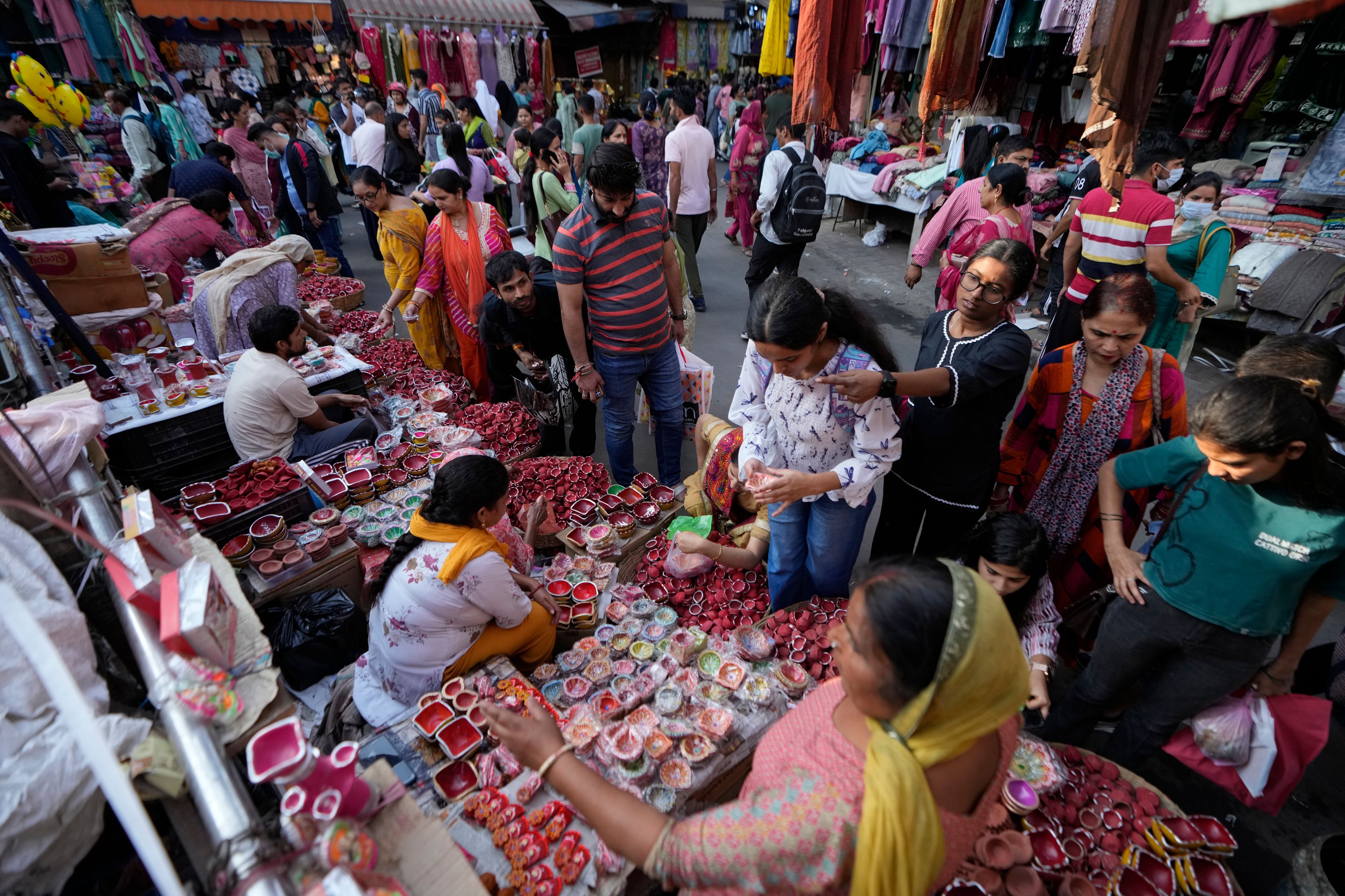 People shops on the eve of Diwali, the Hindu festival of lights, in Jammu, India, Wednesday, Oct. 30, 2024.Diwali is one of Hinduism's most important festivals, dedicated to the worship of the goddess of wealth Lakshmi. (AP Photo/Channi Anand)