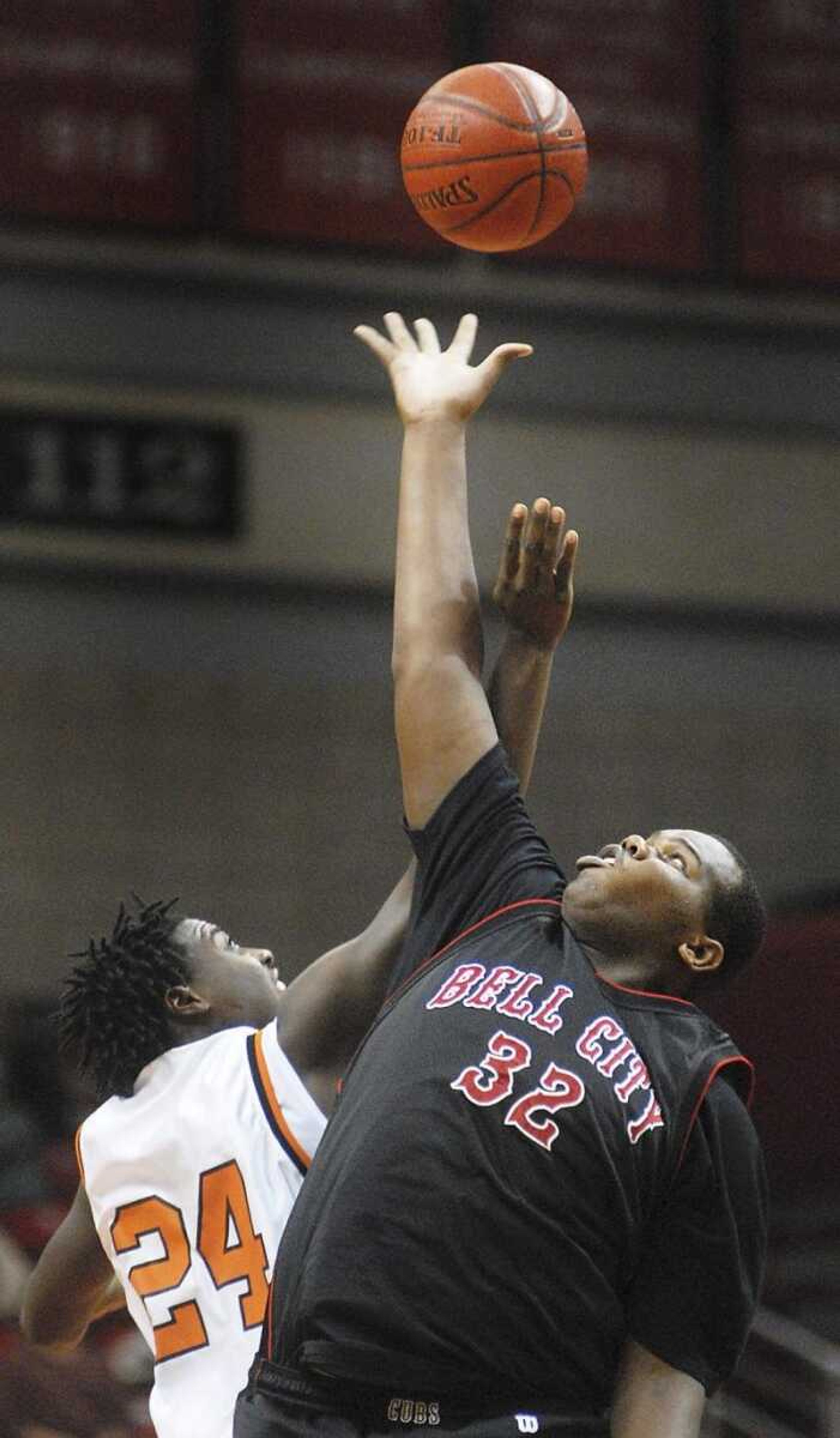 Bell City's Will Bogan reached above Scott County Central's Caleb Johnson to win the tipoff in Wednesday's second round game at the Southeast Missourian Christmas Tournament. (Aaron Eisenhauer)