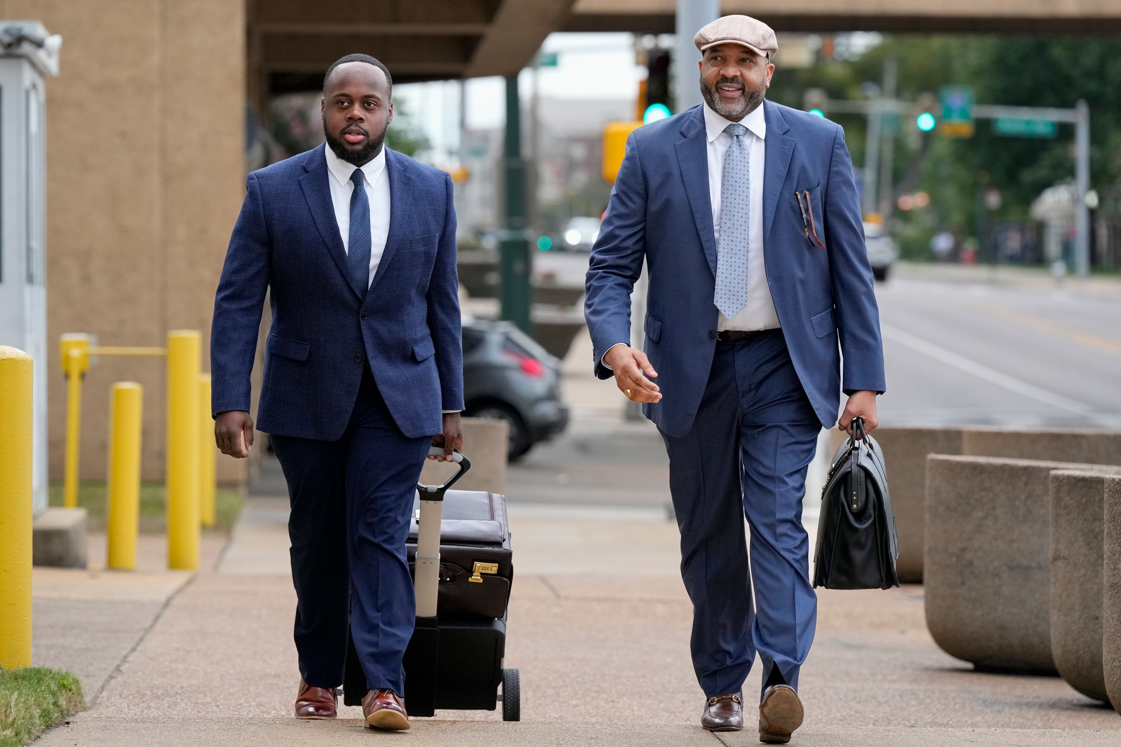 Former Memphis police officer Tadarrius Bean, left, arrives at the federal courthouse with his attorney John Keith Perry, right, for the day's proceedings during the trial in the Tyre Nichols case Wednesday, Sept. 25, 2024, in Memphis, Tenn. (AP Photo/George Walker IV)