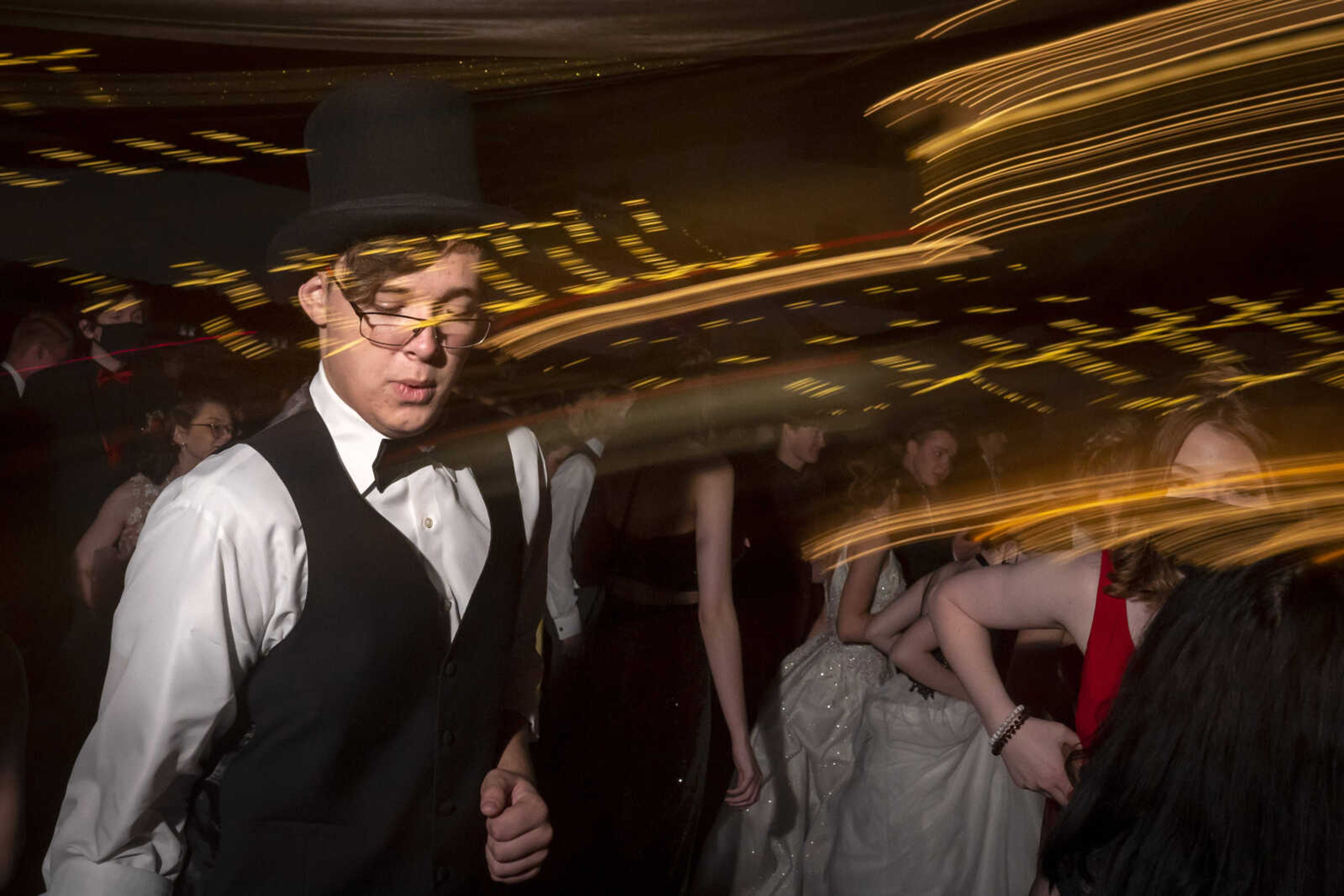 Samuel Helle, in top hat, dances during prom Saturday, May 1, 2021 at Jackson High School.