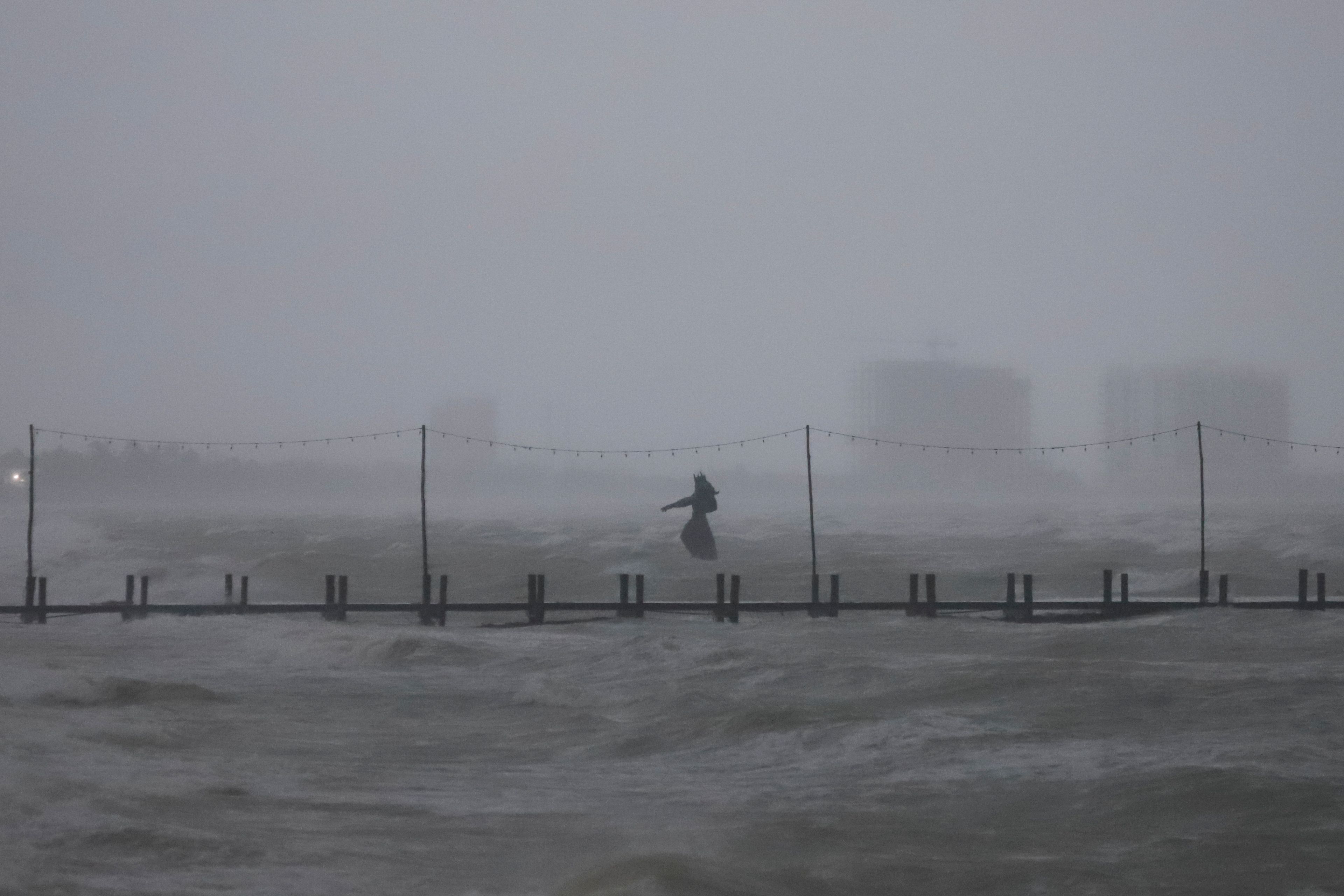 A sculpture of Poseidon stands in the ocean after the eye of Hurricane Milton passed off the coast of Progreso, Yucatan state, Mexico, Tuesday, Oct. 8, 2024. (AP Photo/Martin Zetina)