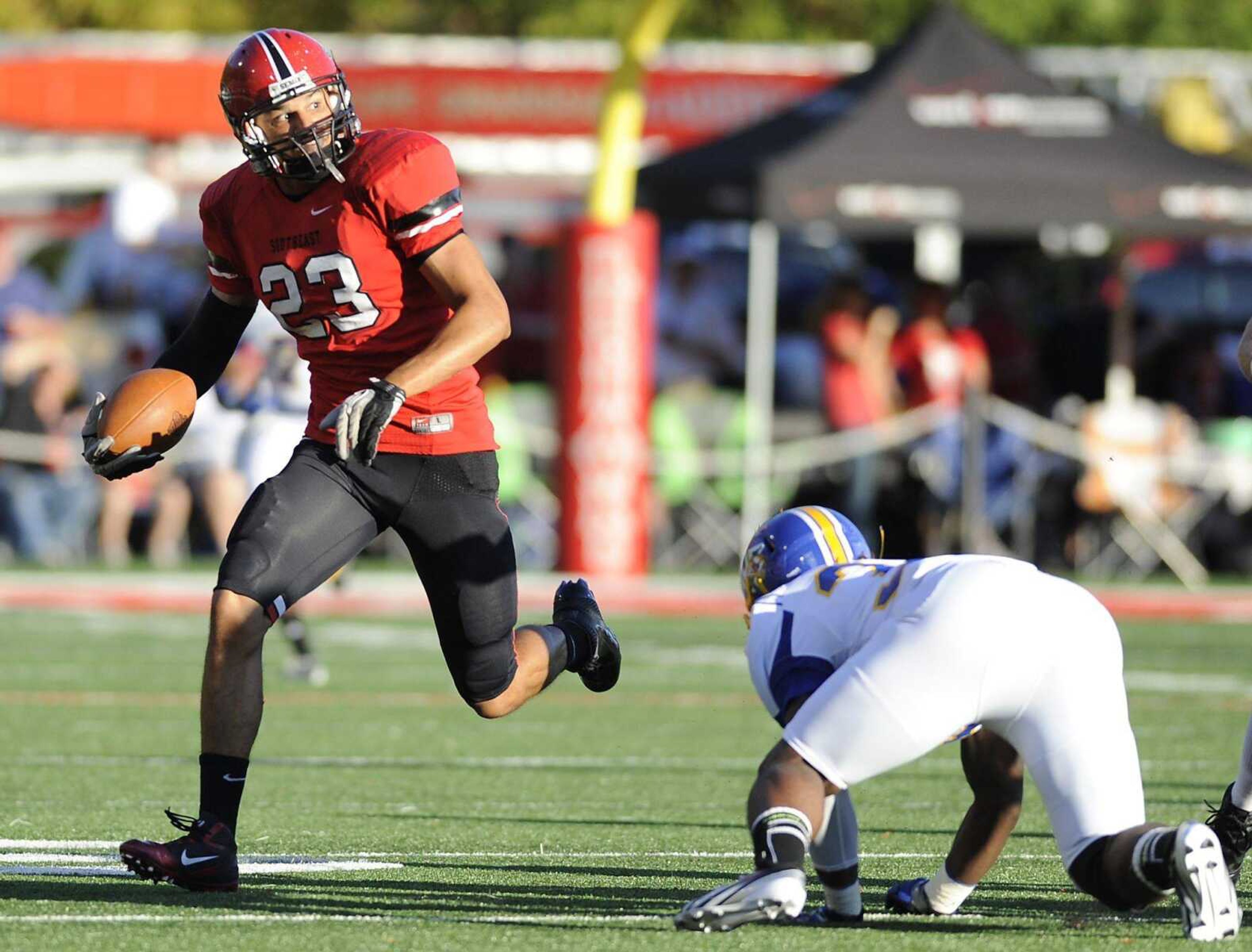 Southeast Missouri State free safety Tylor Brock cuts toward the sideline after intercepting a Mars Hill pass during the Redhawks 30-18 win over the Lions Saturday, September 8. (ADAM VOGLER)