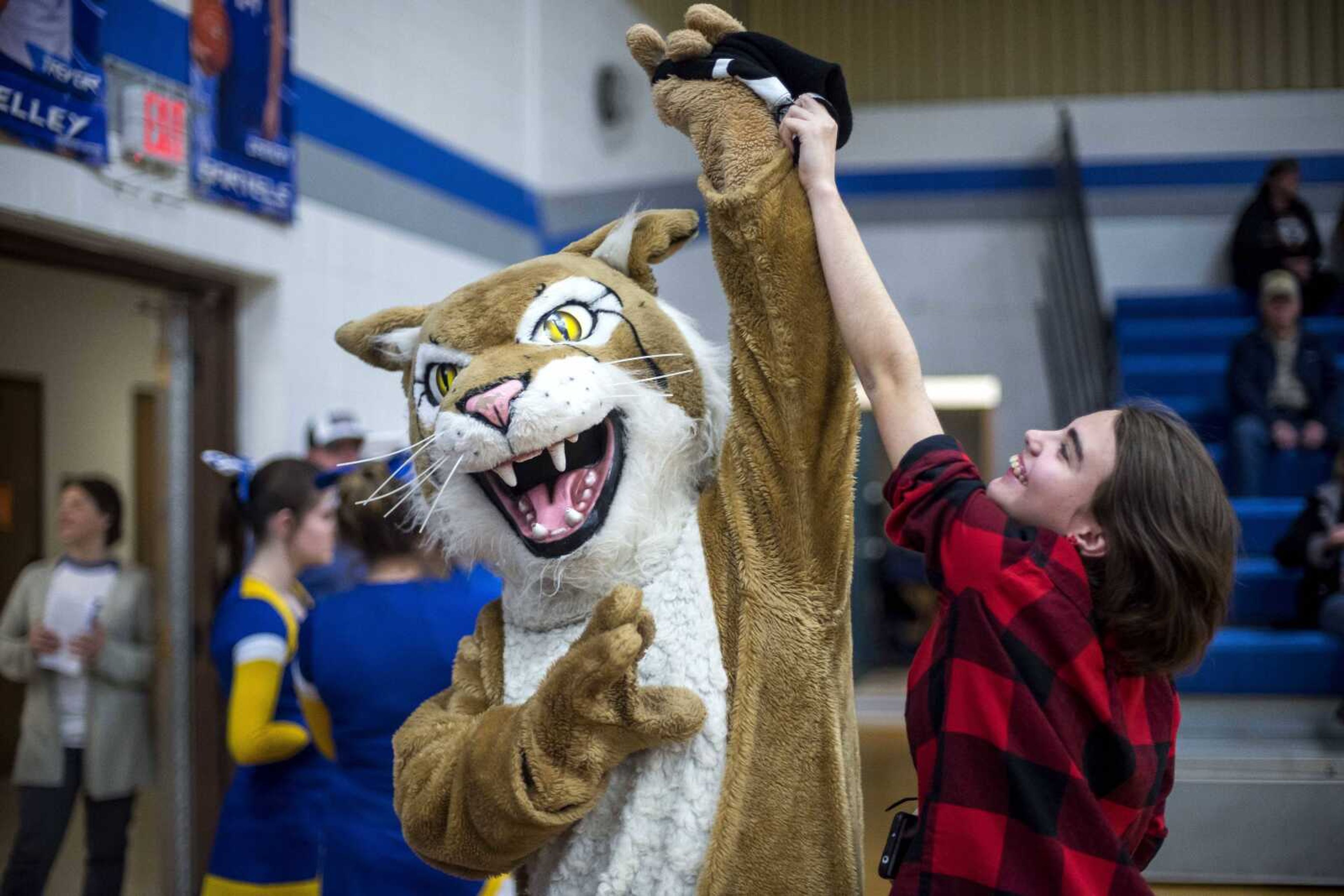 The Delta Bobcat, having swiped Aliya Callaway's hat, teases the Delta student before a basketball game Tuesday, Jan. 8, 2019.