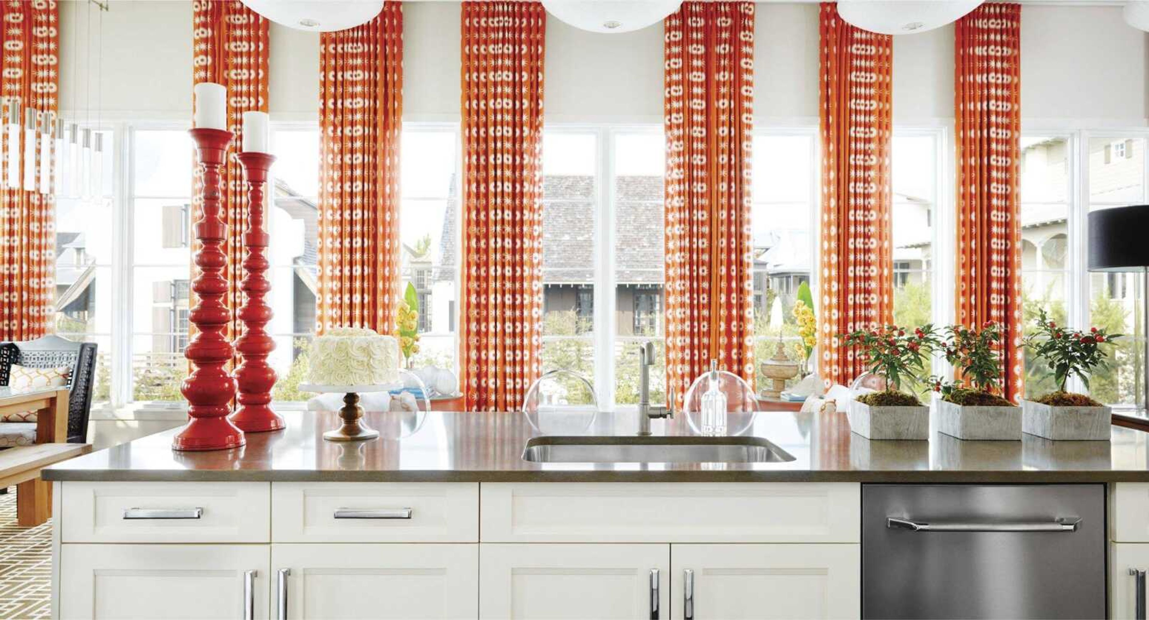 This undated photo provided by Vern Yip shows a kitchen in Florida designed by Yip. After several years of focus on gold and other yellow-hued metals, Yip says hardware finished in  silver metals  like pewter, nickel and chrome and designed in geometric shapes are now trending in kitchen hardware, as show in this sun-filled kitchen. (Vern Yip via AP)